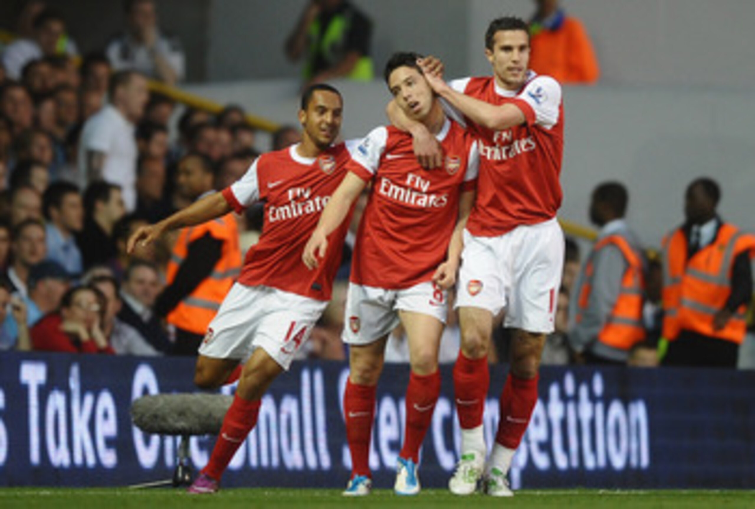 LONDON, ENGLAND - APRIL 20:  Samir Nasri of Arsenal celebrates scoring their second goal with team mates Robin van Persie and Theo Walcott during the Barclays Premier League match between Tottenham Hotspur and Arsenal at White Hart Lane on April 20, 2011
