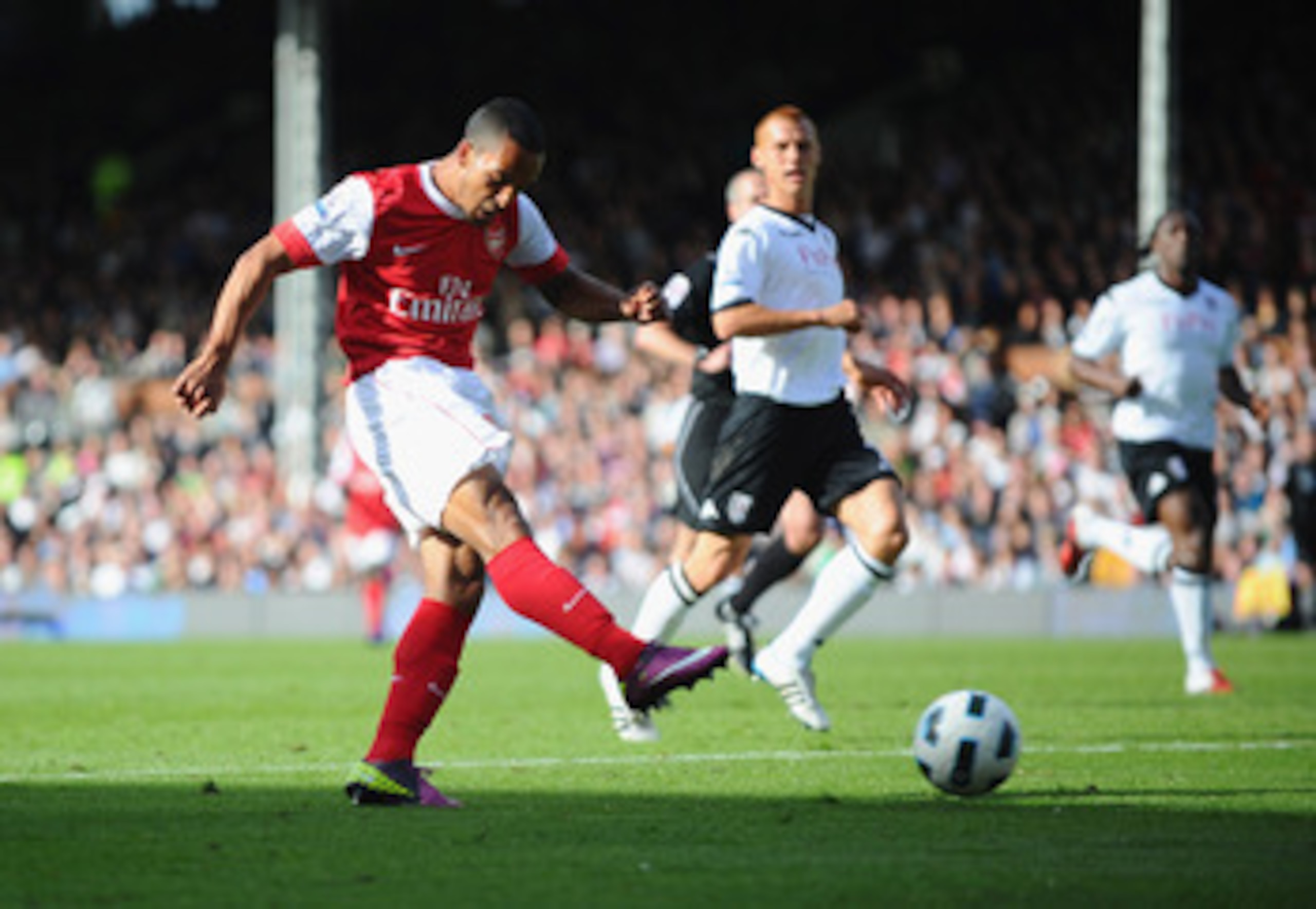 LONDON, ENGLAND - MAY 22:  Theo Walcott of Arsenal scores during the Barclays Premier League match between Fulham and Arsenal at Craven Cottage on May 22, 2011 in London, England.  (Photo by Clive Mason/Getty Images)