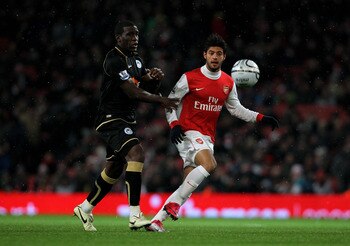 LONDON, ENGLAND - NOVEMBER 30: Hendry Thomas (L) of Wigan in action against Carlos Vela of Arsenal during the Carling Cup quarter final match between Arsenal and Wigan Athletic at the Emirates Stadium on November 30, 2010 in London, England.  (Photo by Cl