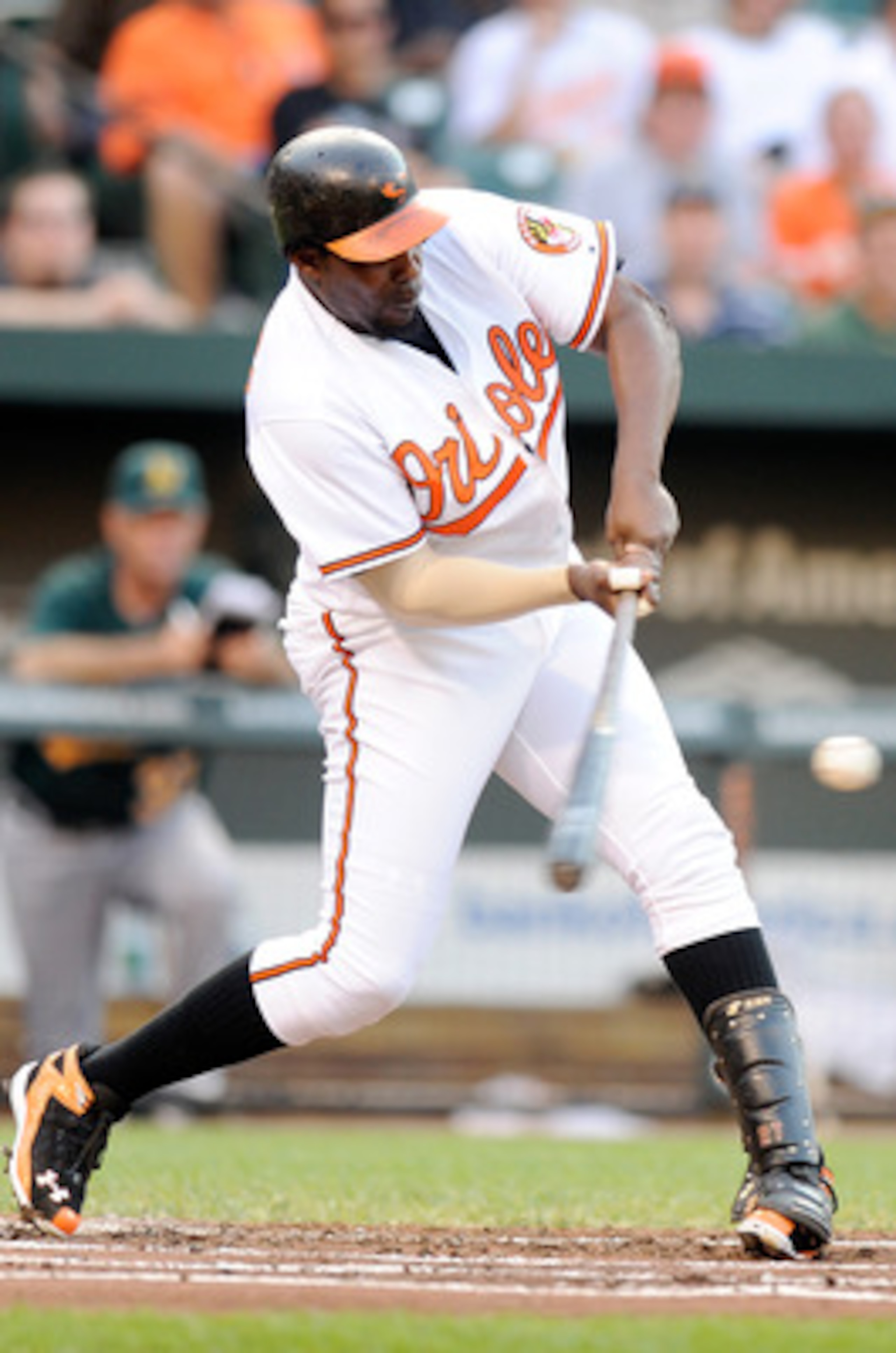 BALTIMORE, MD - JUNE 06:  Vladimir Guerrero #27 of the Baltimore Orioles hits a single in the first inning against the Oakland Athletics at Oriole Park at Camden Yards on June 6, 2011 in Baltimore, Maryland.  (Photo by Greg Fiume/Getty Images)