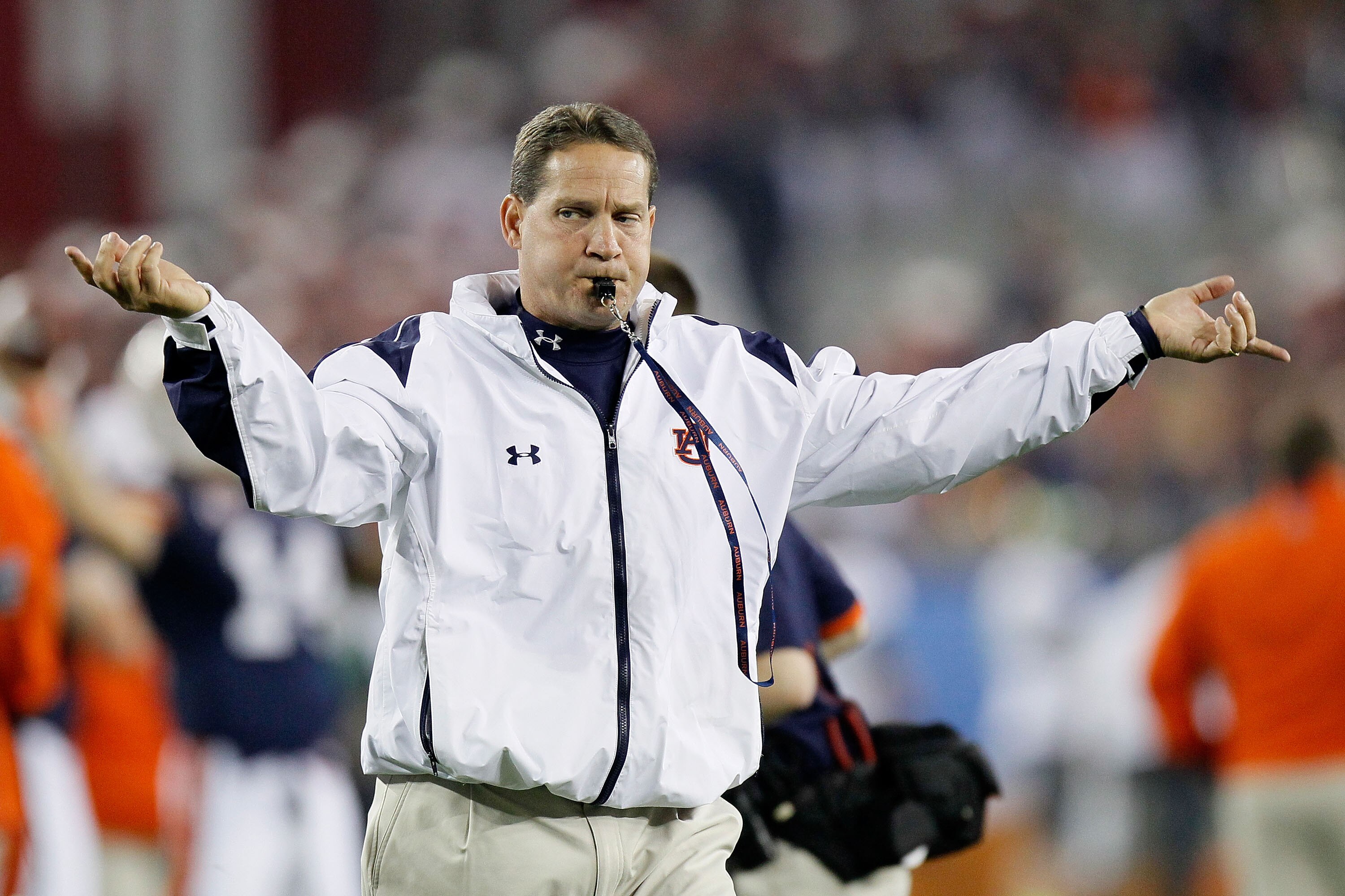 GLENDALE, AZ - JANUARY 10:  Head coach Gene Chizik of the Auburn Tigers reacts on the sideline against the Oregon Ducks during the Tostitos BCS National Championship Game at University of Phoenix Stadium on January 10, 2011 in Glendale, Arizona.  (Photo b