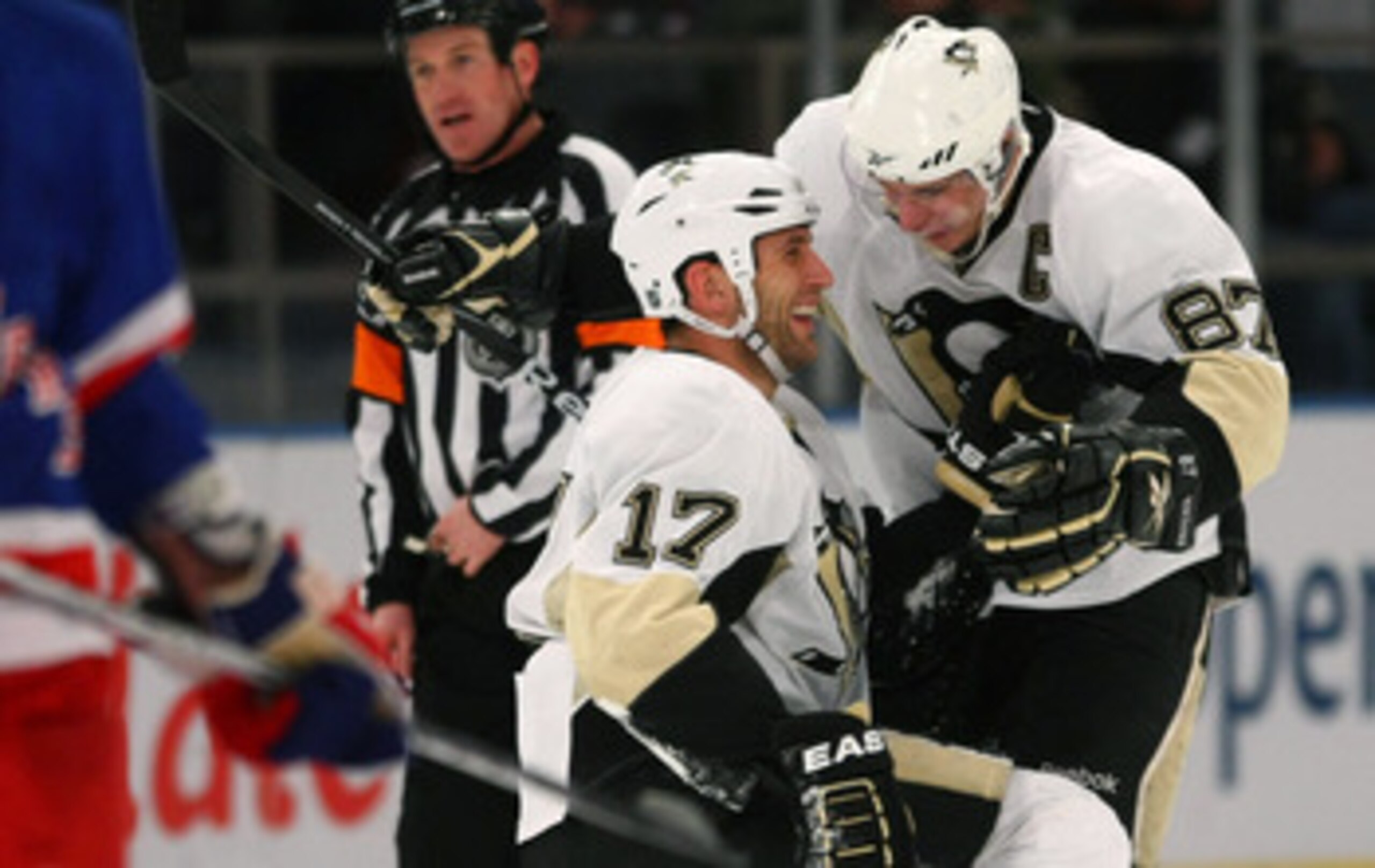 NEW YORK - NOVEMBER 30: Sidney Crosby #87 (R) of the Pittsburgh Penguins hugs Michael Rupp #17 (L) after Rupp's empty net goal in the third period against the New York Rangers at Madison Square Garden on November 30, 2009 in New York City. The Penguins de