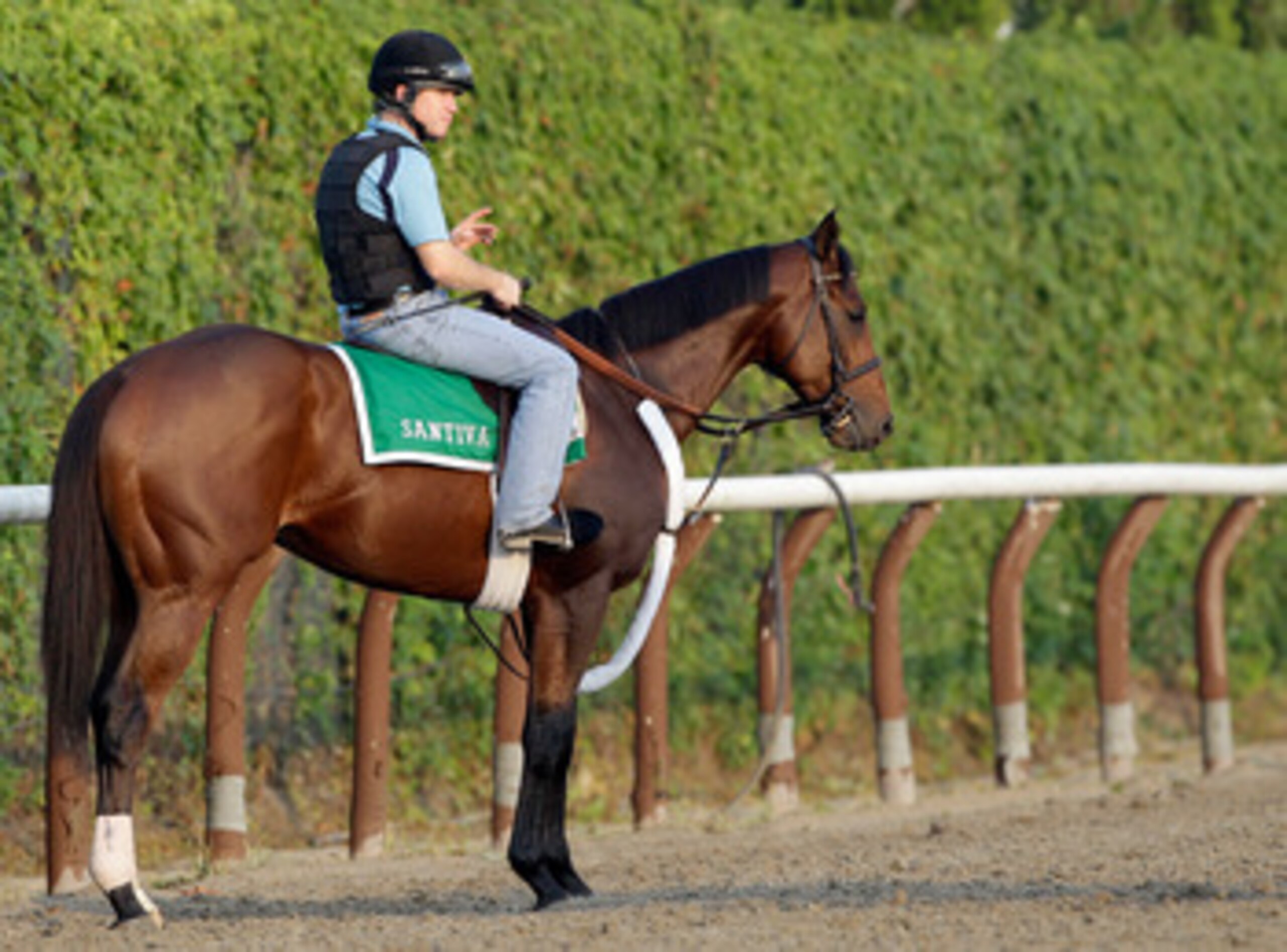 ELMONT, NY - JUNE 10: Exercise rider Brendan Walsh waits to take Santiva for a morning training session in preparation for the 143rd running of The Belmont Stakes at Belmont Park on June 10, 2011 in Elmont, New York. (Photo by Rob Carr/Getty Images) ELMONT, NY - JUNE 10: Exercise rider Brendan Walsh waits to take Santiva for a morning training session in preparation for the 143rd running of The Belmont Stakes at Belmont Park on June 10, 2011 in Elmont, New York. (Photo by Rob Carr/Getty Images)