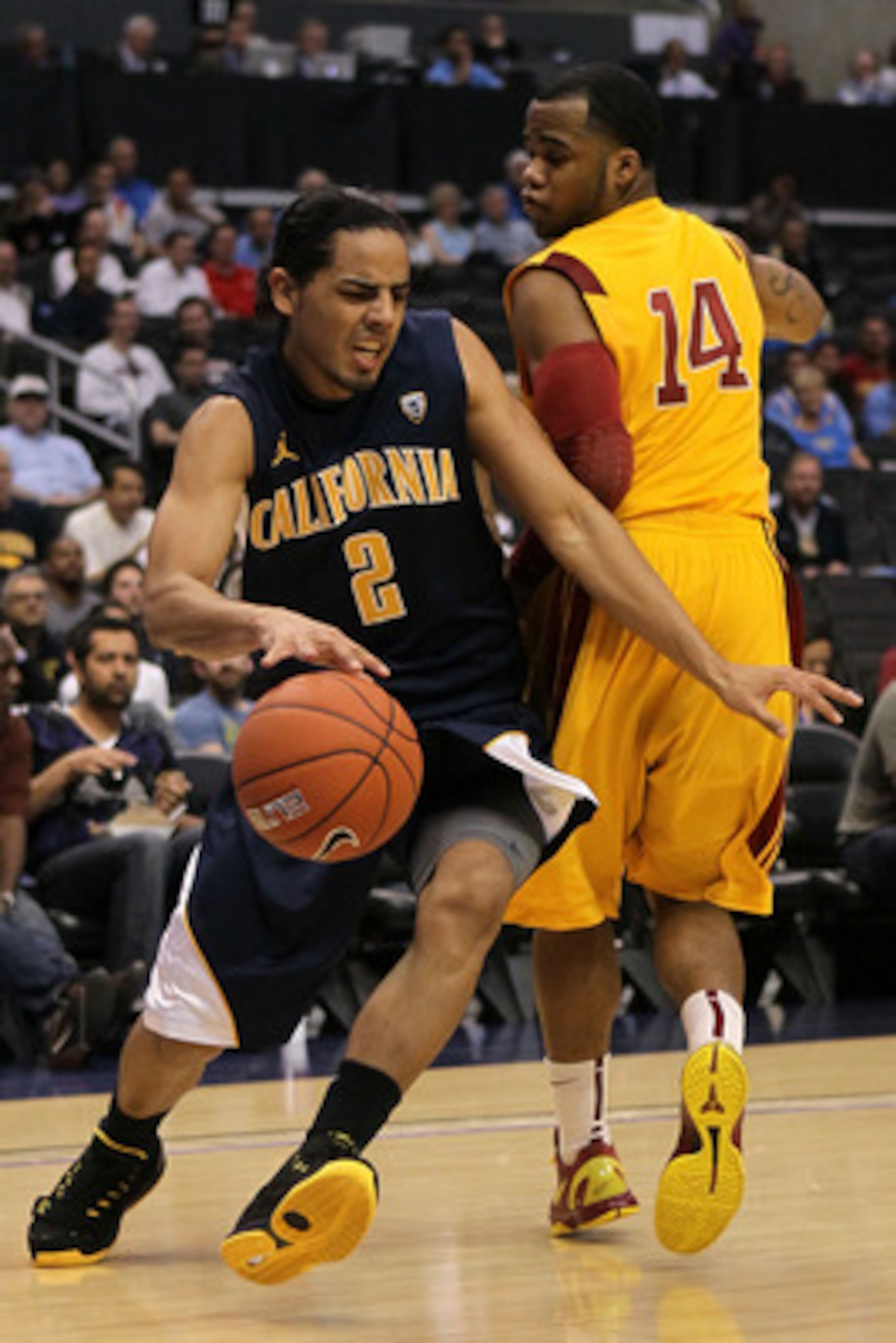 LOS ANGELES, CA - MARCH 10:  Jorge Gutierrez #2 of the California Golden Bears drives by Donte Smith #14 of the USC Trojans in the first half in the quarterfinals of the 2011 Pacific Life Pac-10 Men's Basketball Tournament at Staples Center on March 10, 2