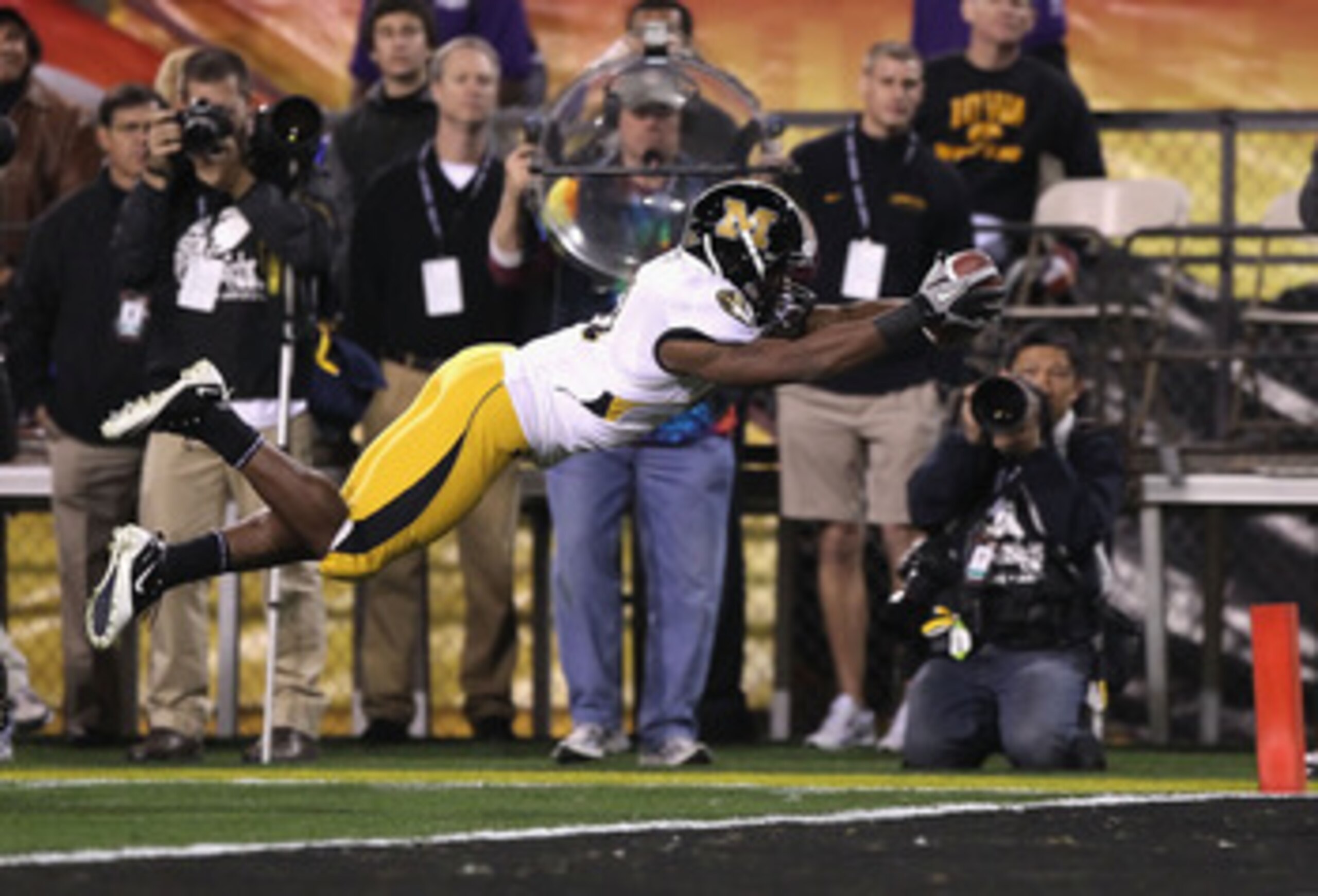 TEMPE, AZ - DECEMBER 28:  Runningback Henry Josey #41 of the Missouri Tigers dives into the endzone to score on a 10 yard rushing touchdown against the Iowa Hawkeyes during the second quarter of the Insight Bowl at Sun Devil Stadium on December 28, 2010 i