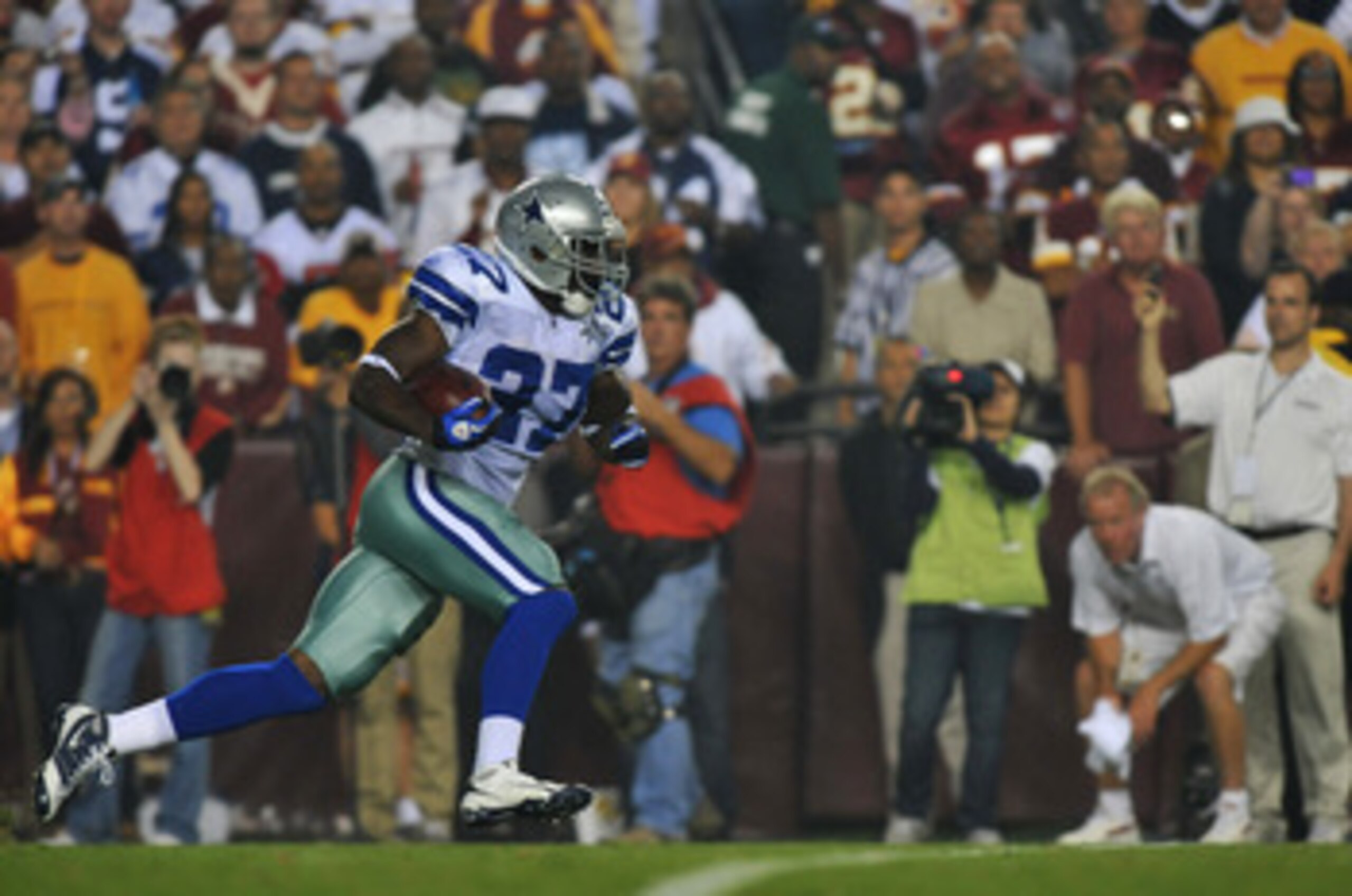 LANDOVER - SEPTEMBER 12:  Akwasi Owusu-Ansah #27 of the Dallas Cowboys returns a kick during the NFL season opener against the Washington Redskins at FedExField on September 12, 2010 in Landover, Maryland. The Redskins defeated the Cowboys 13-7. (Photo by