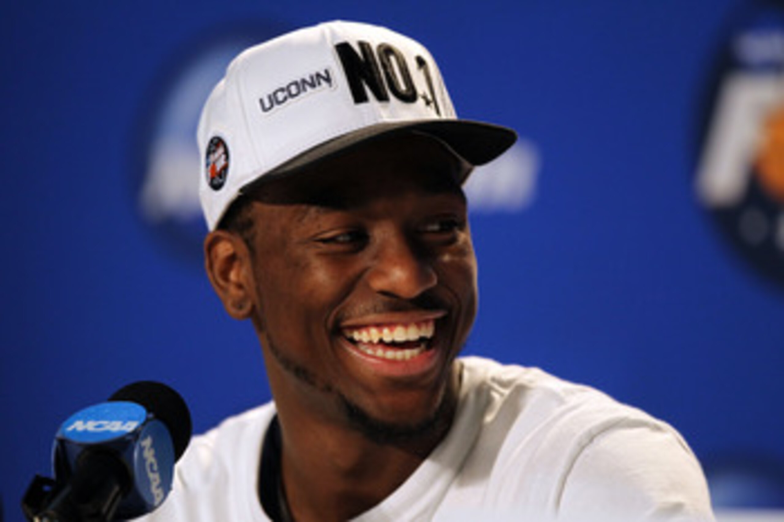 HOUSTON, TX - APRIL 04:  Kemba Walker #15 of the Connecticut Huskies speaks to the media after defeating the Butler Bulldogs to win the National Championship Game of the 2011 NCAA Division I Men's Basketball Tournament at Reliant Stadium on April 4, 2011