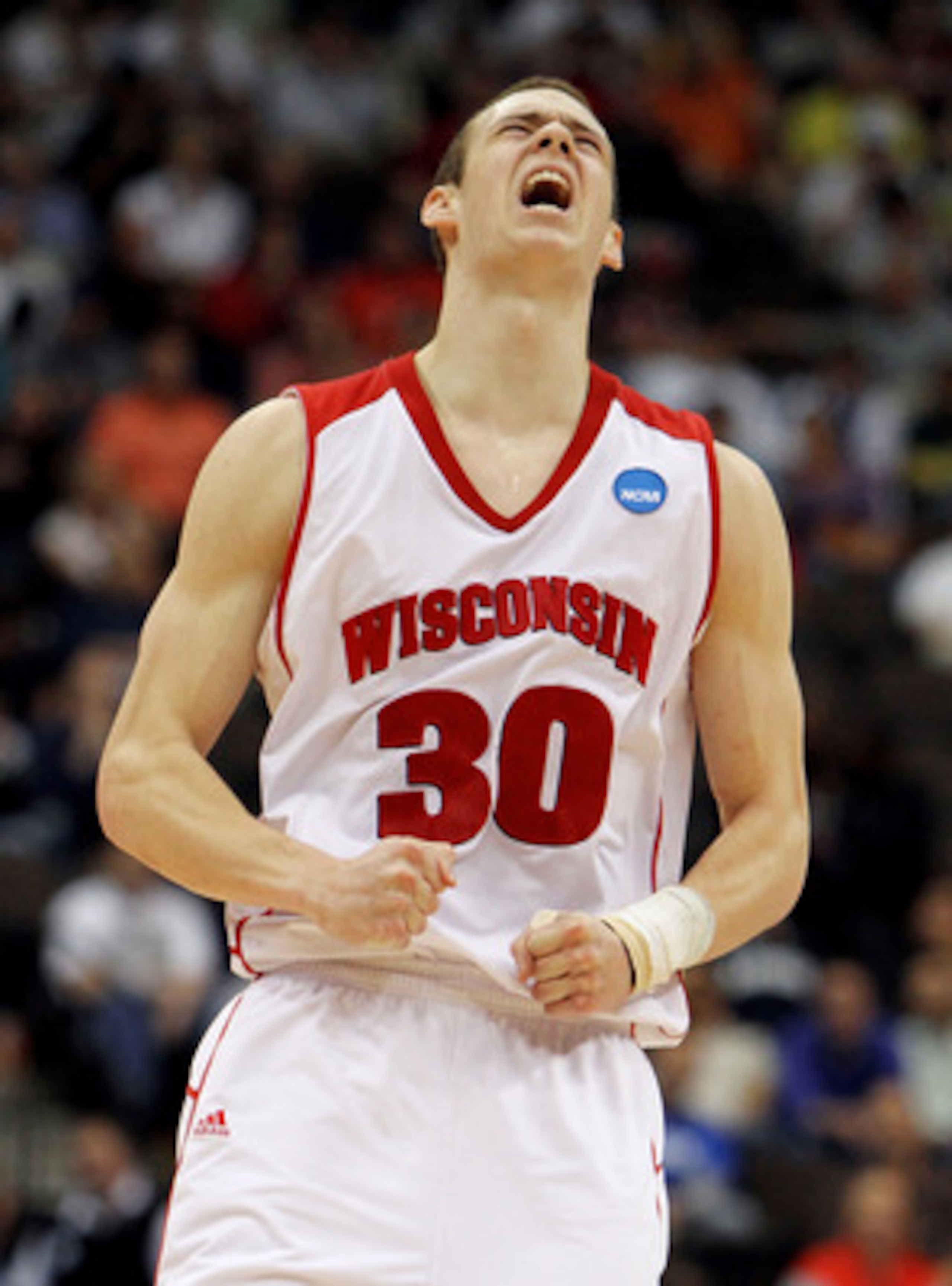 JACKSONVILLE, FL - MARCH 19:  Jon Leuer #30 of the Wisconsin Badgers celebrates after hitting a shot in the second half against the Wofford Terriers during the first round of the 2010 NCAA men's basketball tournament at Jacksonville Veteran's Memorial Are