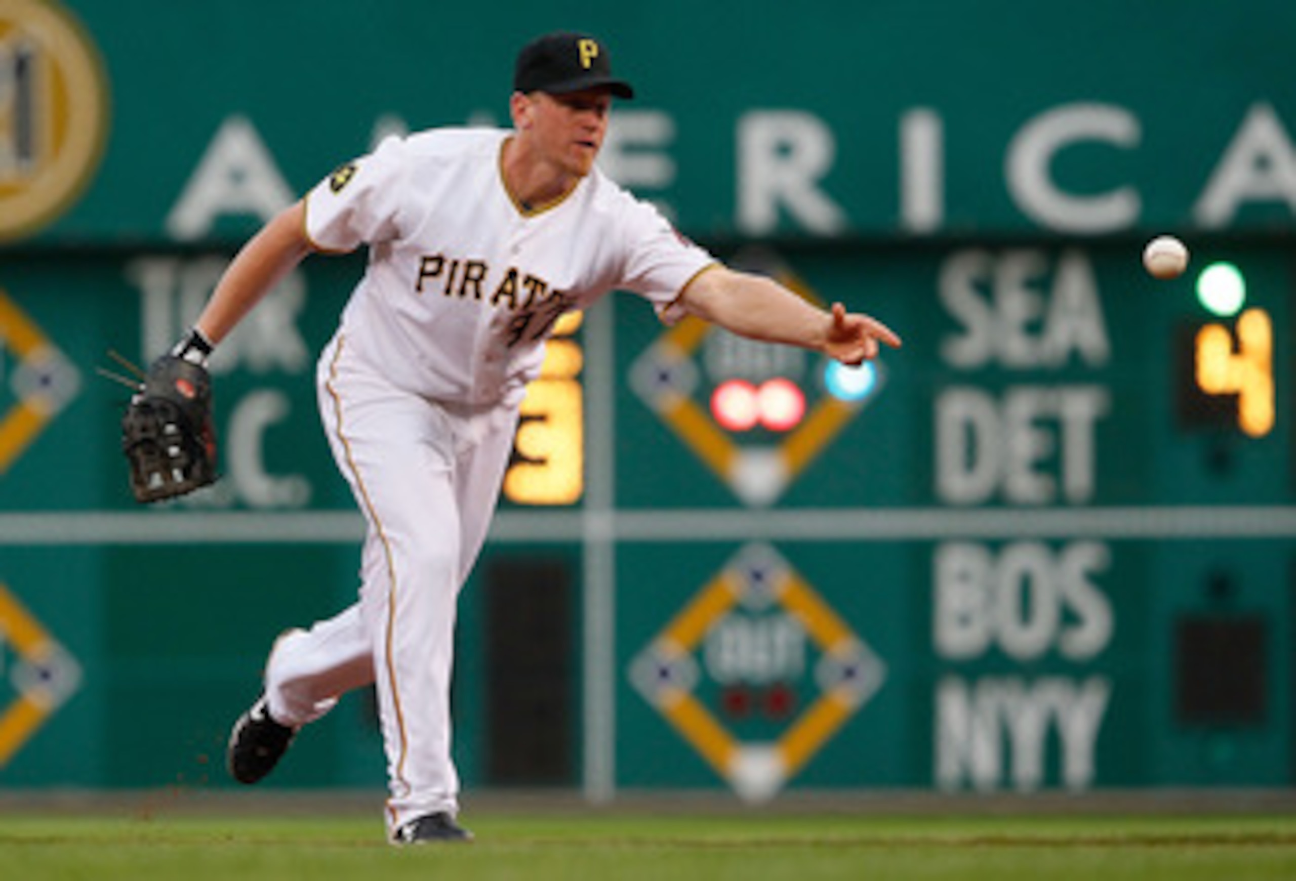 PITTSBURGH - JUNE 09:  Lyle Overbay #37 of the Pittsburgh Pirates flips the ball to first base against the Arizona Diamondbacks during the game on June 9, 2011 at PNC Park in Pittsburgh, Pennsylvania.  (Photo by Jared Wickerham/Getty Images)