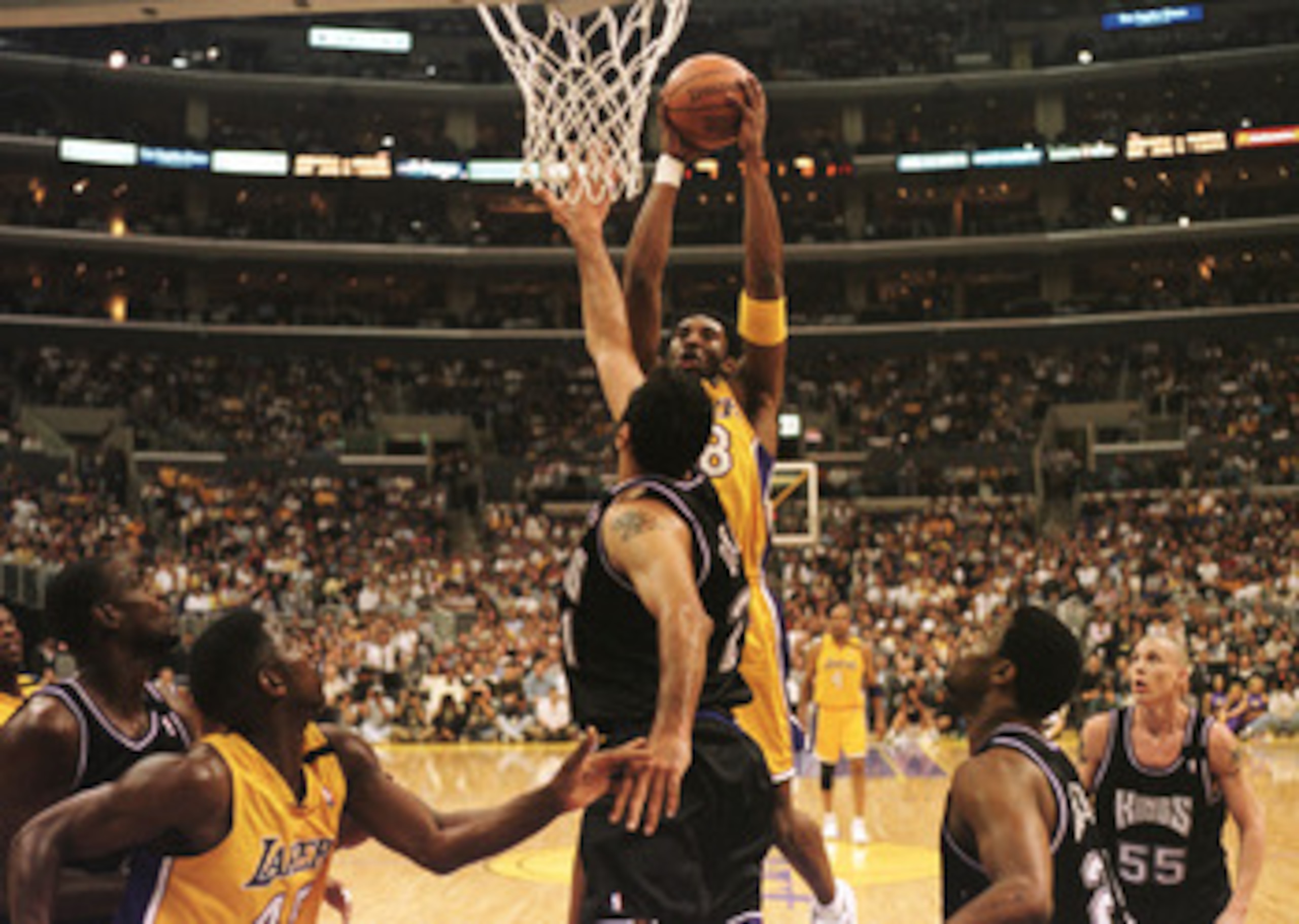 27 Apr 2000: Guard Kobe Bryant #8 of the Los Angeles Lakers shoots over center Vlade Divac #21 of the Sacramento Kings during their first round playoff game at Staples Center in Los Angeles, California.