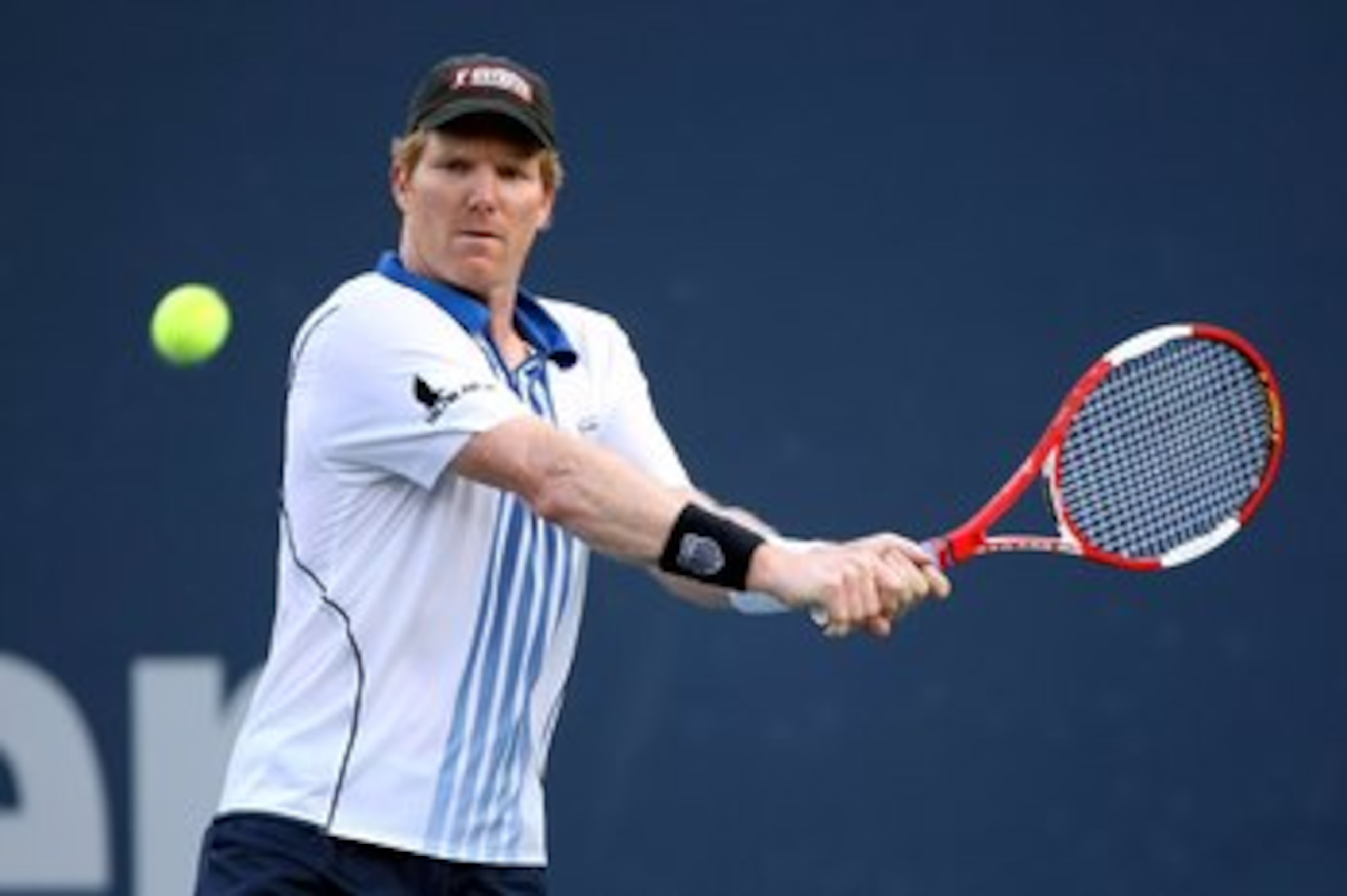 LOS ANGELES, CA - JULY 29:  Jim Courier returns a shot to Stefan Edberg during the Legends match at the LA Tennis Open Day Three at Los Angeles Tennis Center - UCLA on July 29, 2009 in Los Angeles, California.  Courier defeated Edberg 4-6, 6-4, 11-9.  (Ph