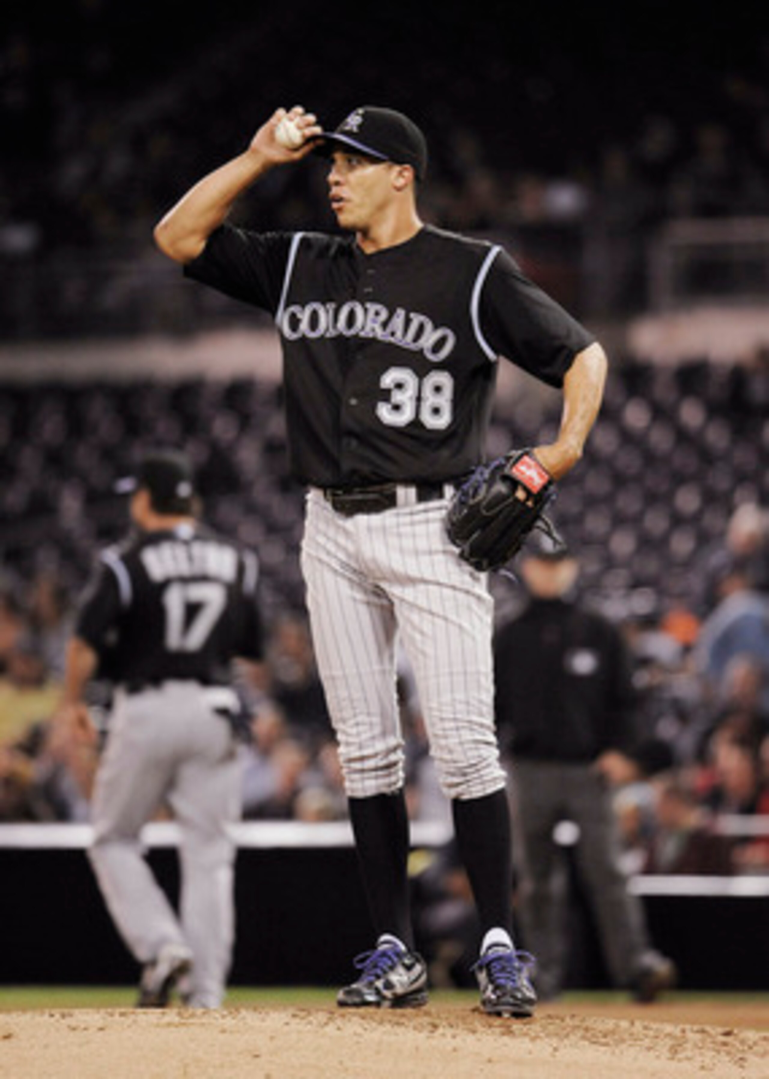 SAN DIEGO, CA - JUNE 7: Ubaldo Jimenez #38 of the Colorado Rockies looks up at the scoreboard after giving up a run in the fifthinning of a baseball game against the San Diego Padres at Petco Park on June 7, 2011 in San Diego, California.  (Photo by Denis