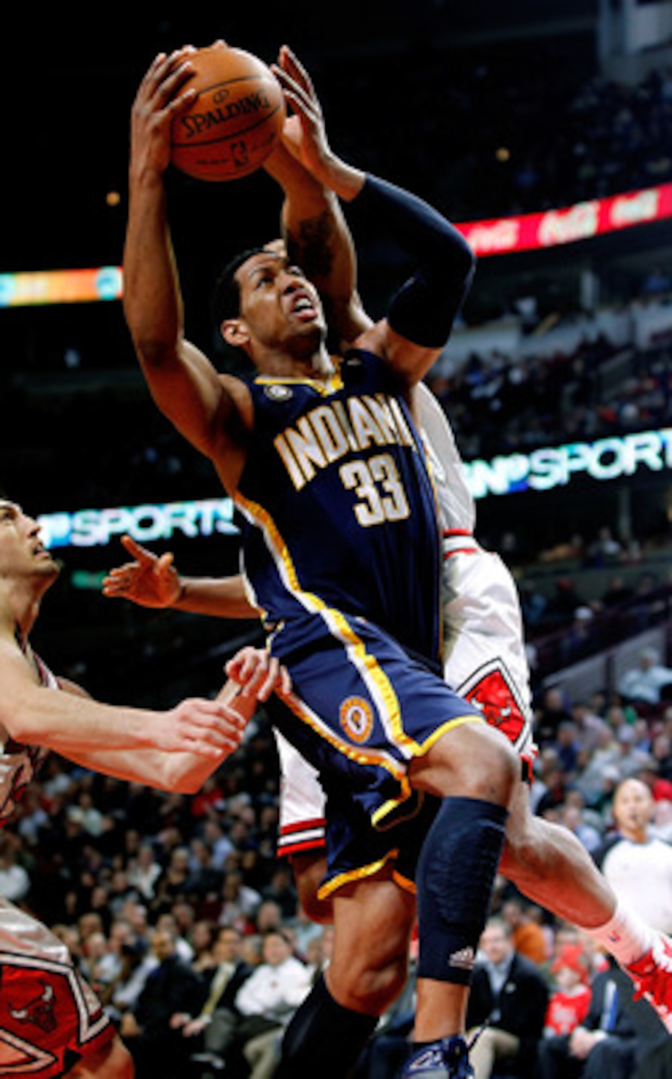 CHICAGO - FEBRUARY 24: Danny Granger #33 of the Indiana Pacers goes up for a shot between Kirk Hinrich #12 and James Johnson #16 of the Chicago Bulls at the United Center on February 24, 2010 in Chicago, Illinois. NOTE TO USER: User expressly acknowledges CHICAGO - FEBRUARY 24: Danny Granger #33 of the Indiana Pacers goes up for a shot between Kirk Hinrich #12 and James Johnson #16 of the Chicago Bulls at the United Center on February 24, 2010 in Chicago, Illinois. NOTE TO USER: User expressly acknowledges