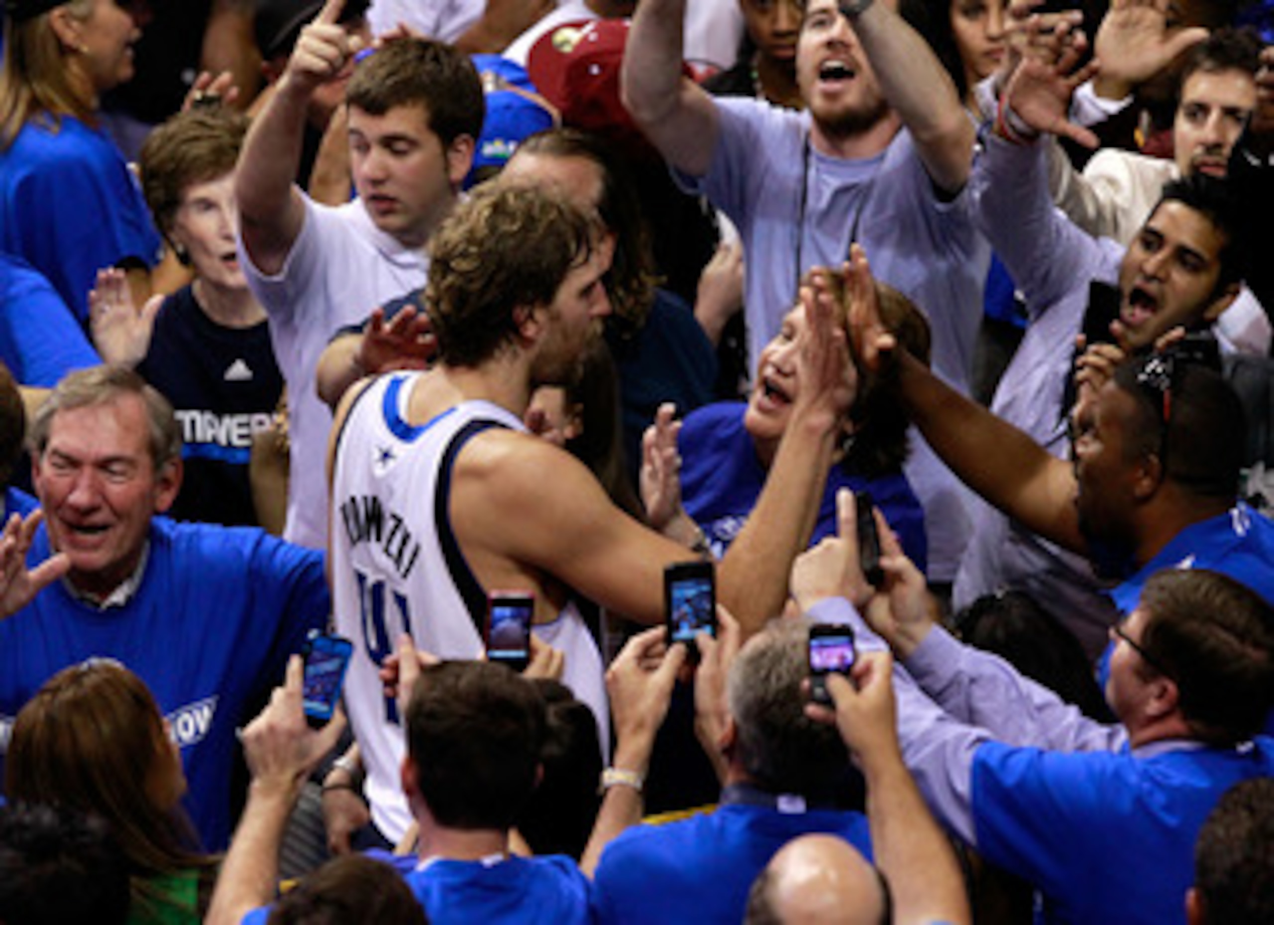 DALLAS, TX - JUNE 09:  Dirk Nowitzki #41 of the Dallas Mavericks celebrates with fans after the won 112-103 against the Miami Heat in Game Five of the 2011 NBA Finals at American Airlines Center on June 9, 2011 in Dallas, Texas.  NOTE TO USER: User expres