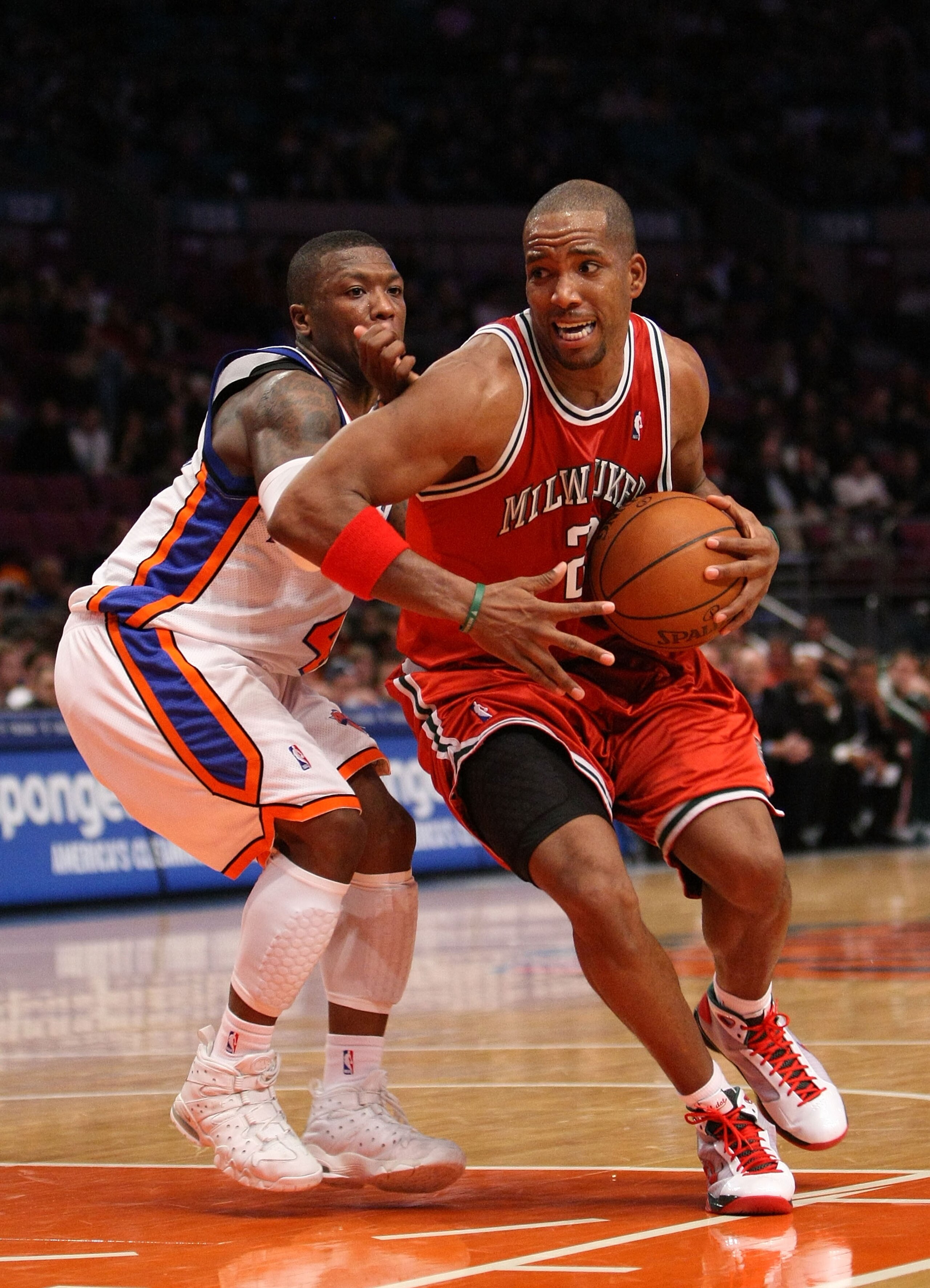 NEW YORK - DECEMBER 19: Michael Redd #22 of the Milwaukee Bucks drives to the basket against Nate Robinson #4 of the New York Knicks on December 19, 2008 at Madison Square Garden in New York City, New York. NOTE TO USER: User expressly acknowledges and ag NEW YORK - DECEMBER 19: Michael Redd #22 of the Milwaukee Bucks drives to the basket against Nate Robinson #4 of the New York Knicks on December 19, 2008 at Madison Square Garden in New York City, New York. NOTE TO USER: User expressly acknowledges and ag