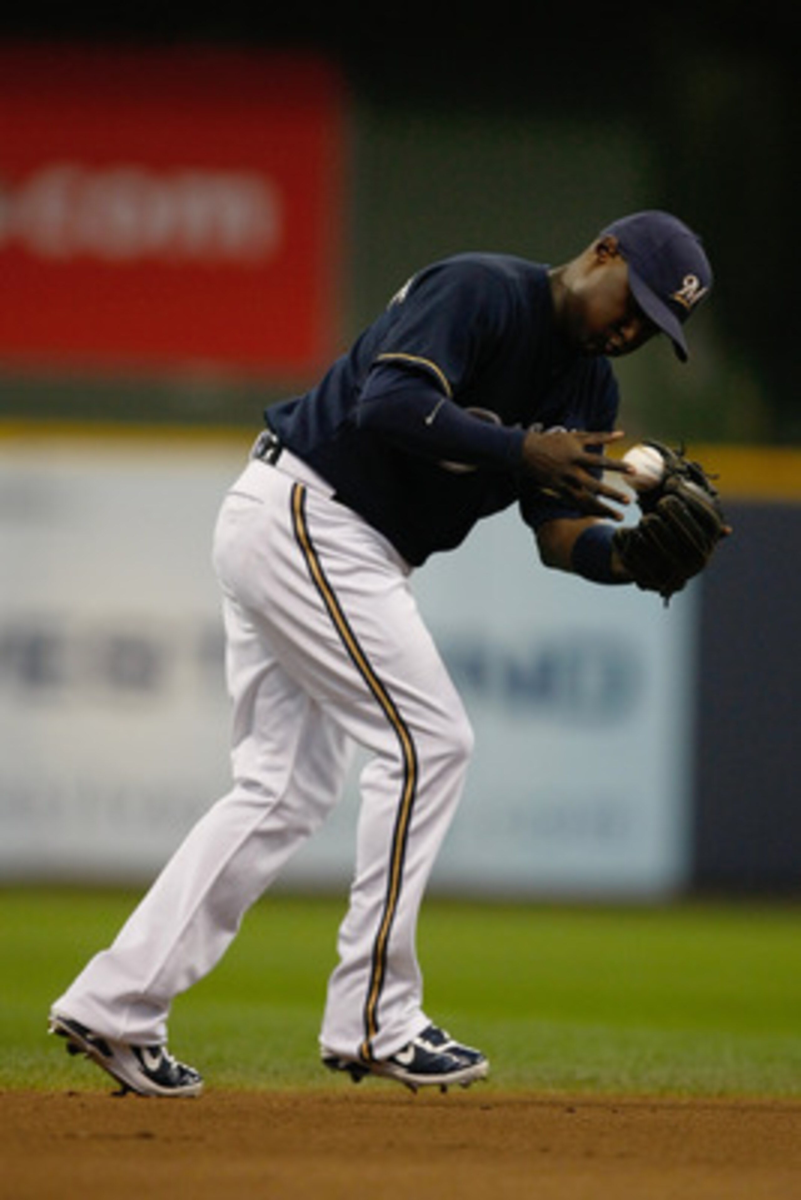 MILWAUKEE, WI - JUNE 9: Yuniesky Betancourt #3 of the Milwaukee Brewers fields the baseball against the New York Mets at Miller Park on June 9, 2011 in Milwaukee, Wisconsin. The Mets defeated the Brewers 4-1. (Photo by Scott Boehm/Getty Images)