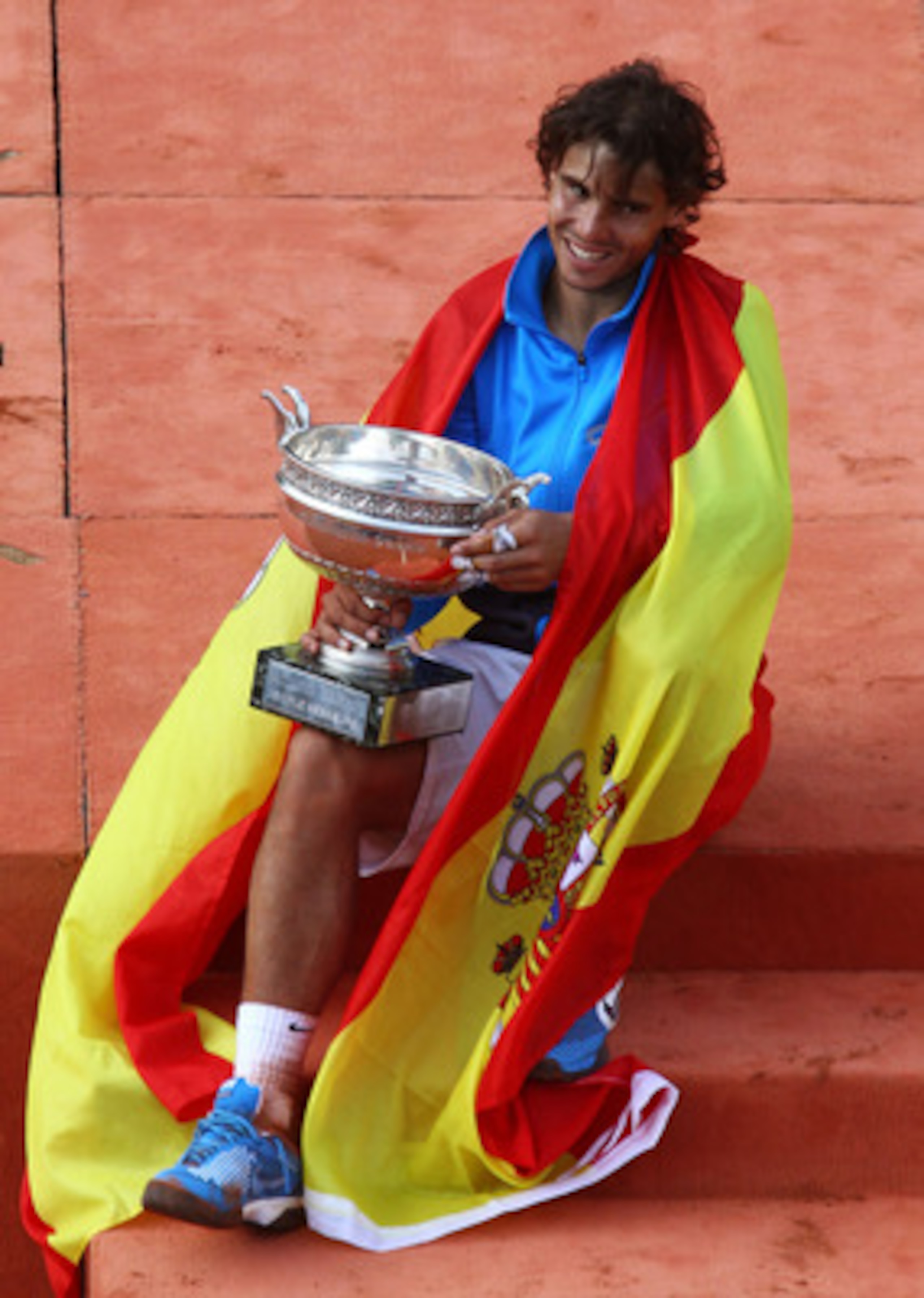 PARIS, FRANCE - JUNE 05:  Champion Rafael Nadal of Spain poses with the trophy following his victory during the men's singles final match between Rafael Nadal of Spain and Roger Federer of Switzerland on day fifteen of the French Open at Roland Garros on