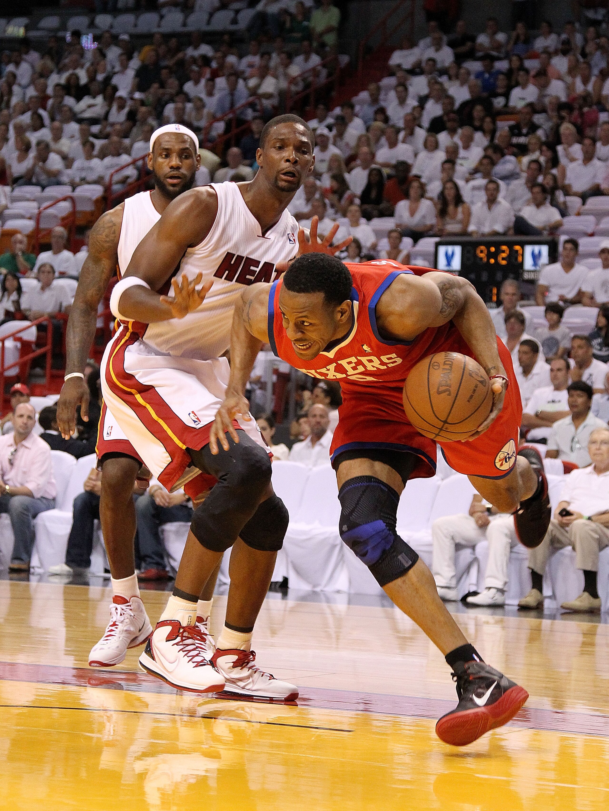 MIAMI, FL - APRIL 27: Andre Iguodala #9 of the Philadelphia 76ers drives to the rim past LeBron James #6 and Chris Bosh #1 of the Miami Heat during game five of the Eastern Conference Quarterfinals in the 2011 NBA Playoffs at American Airlines Arena on A MIAMI, FL - APRIL 27: Andre Iguodala #9 of the Philadelphia 76ers drives to the rim past LeBron James #6 and Chris Bosh #1 of the Miami Heat during game five of the Eastern Conference Quarterfinals in the 2011 NBA Playoffs at American Airlines Arena on A