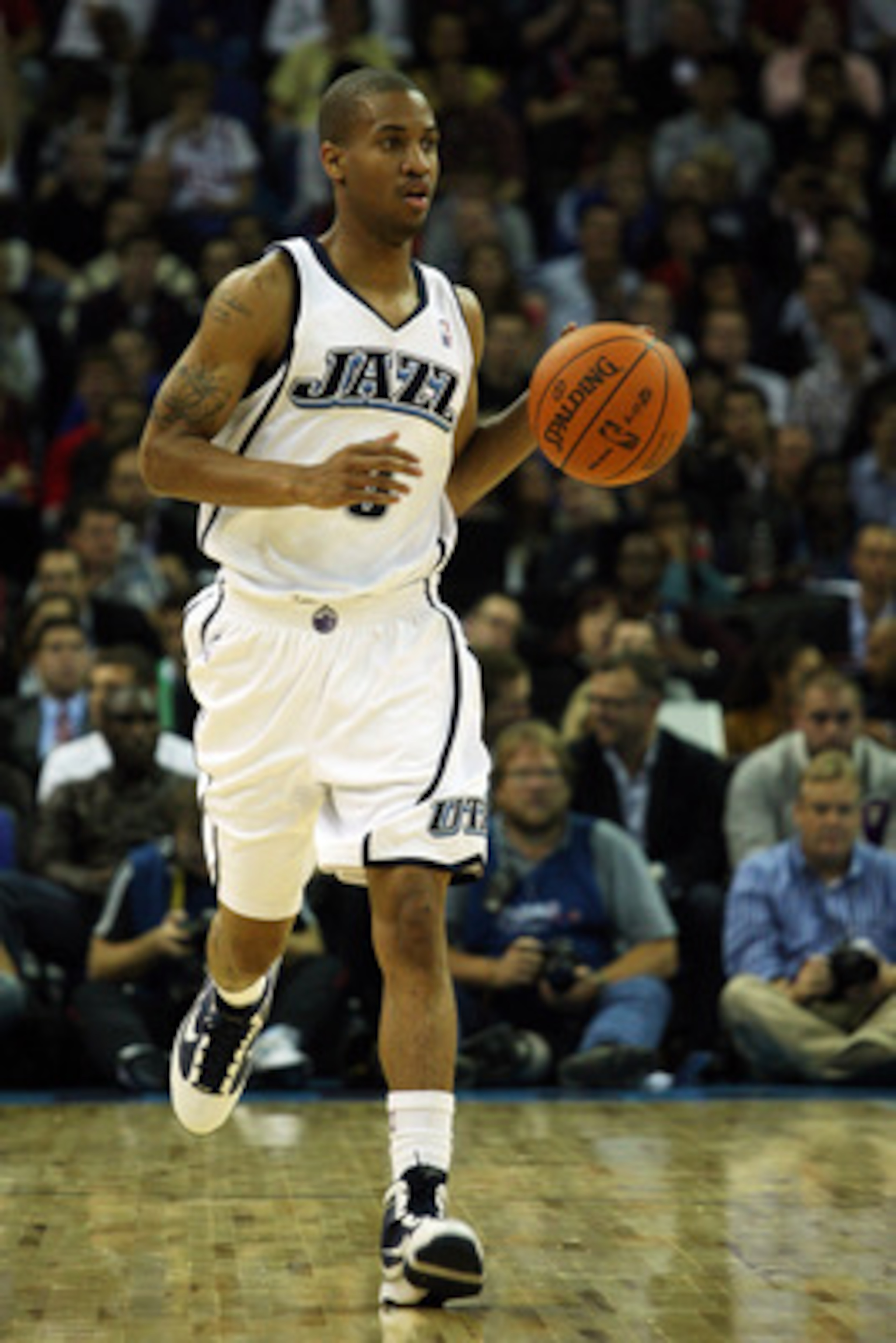 LONDON, ENGLAND - OCTOBER 06:  Eric Maynor of the Utah Jazz runs with the ball during the NBA pre-season game as part of the 2009 NBA Europe Live Tour between Chicago Bulls and Utah Jazz at the O2 Arena on October 6, 2009 in London, England.  NOTE TO USER