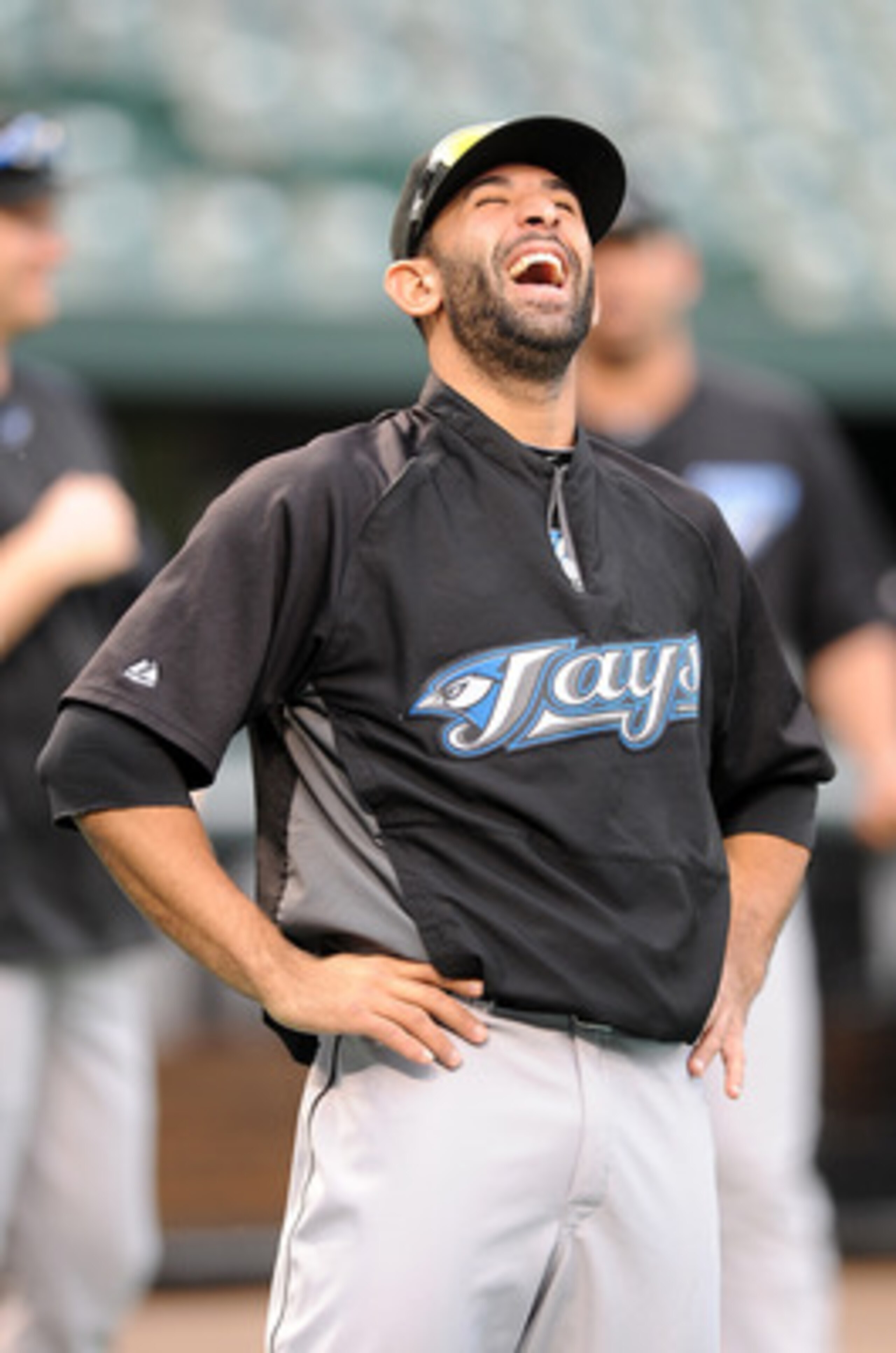 BALTIMORE, MD - JUNE 04:  Jose Bautista #19 of the Toronto Blue Jays laughs with teammates before the game against the Baltimore Orioles at Oriole Park at Camden Yards on June 4, 2011 in Baltimore, Maryland.  (Photo by Greg Fiume/Getty Images)