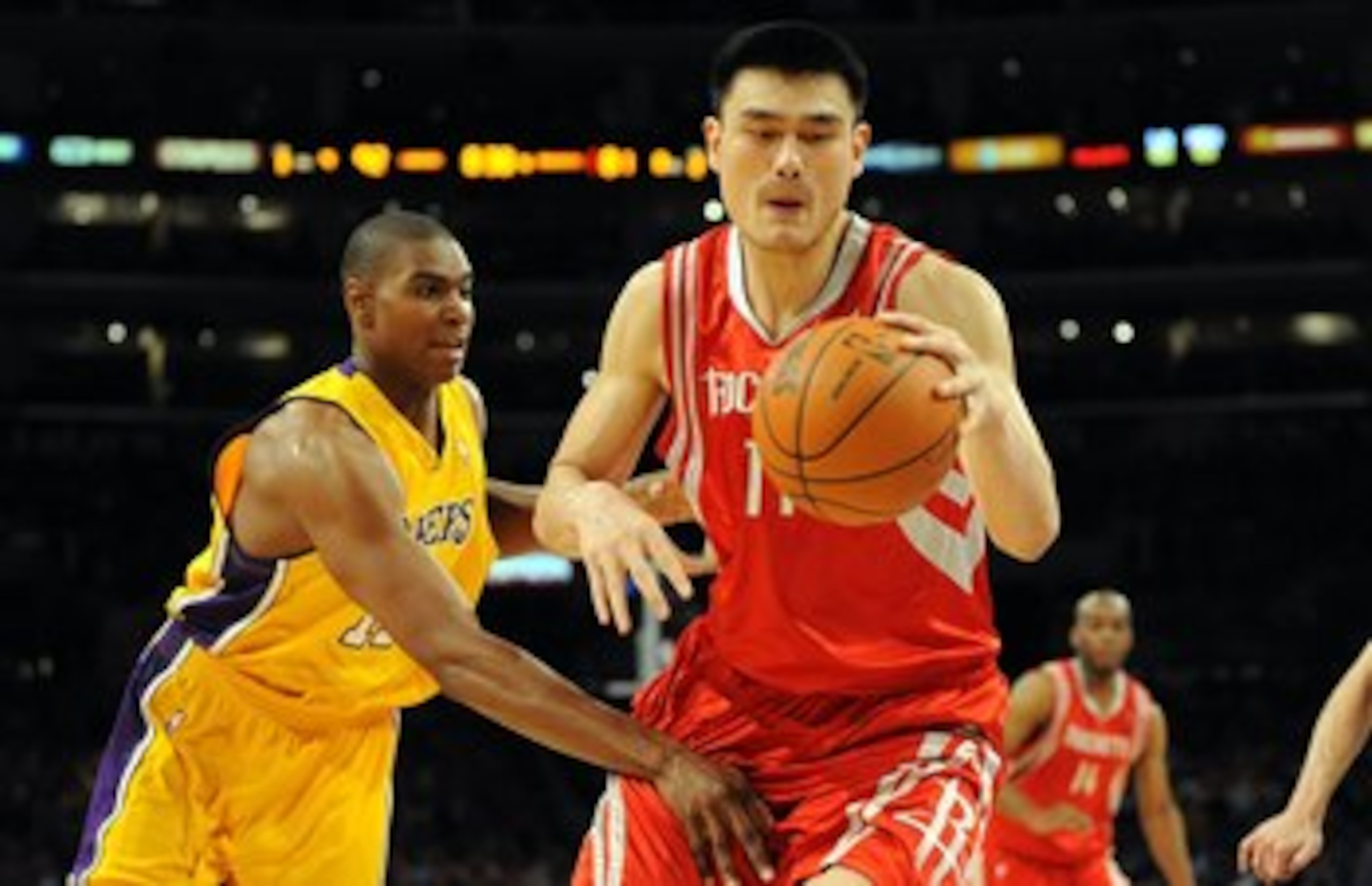 LOS ANGELES, CA - MAY 06:  Yao Ming #11 of the Houston Rockets moves the ball against Andrew Bynum #17 of the Los Angeles Lakers in Game Two of the Western Conference Semifinals during the 2009 NBA Playoffs at Staples Center on May 6, 2009 in Los Angeles,
