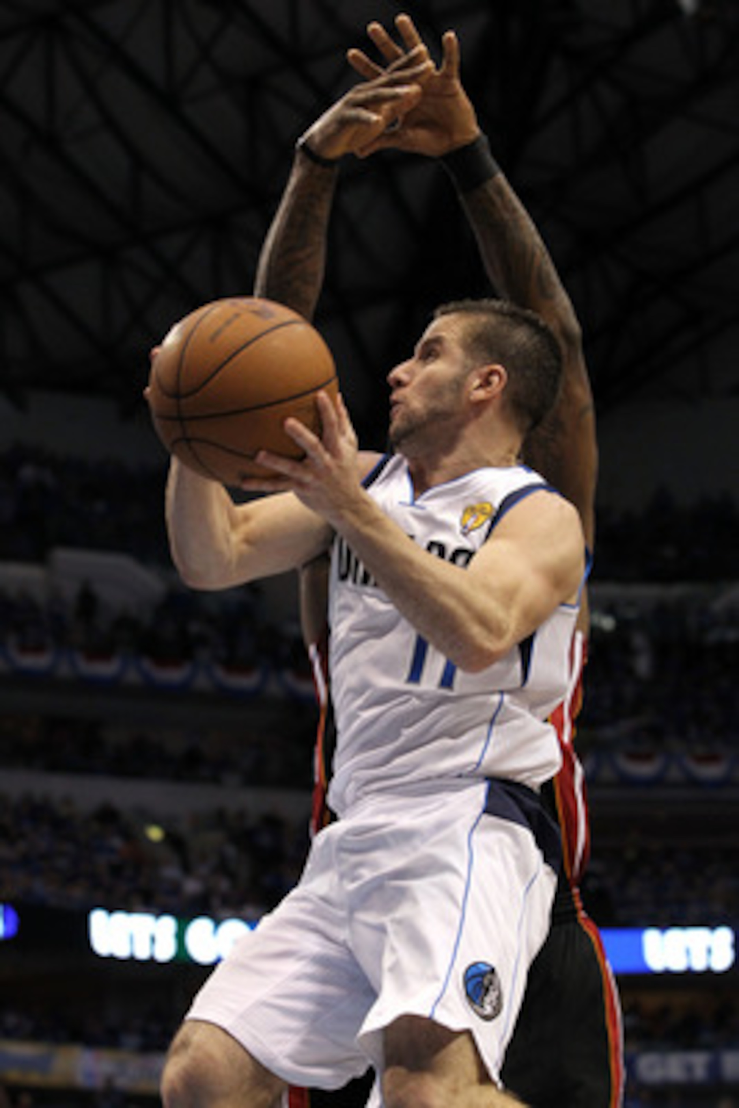 DALLAS, TX - JUNE 09: Jose Juan Barea #11 of the Dallas Mavericks drives for a shot attempt against the Miami Heat in the first half of Game Five of the 2011 NBA Finals at American Airlines Center on June 9, 2011 in Dallas, Texas. NOTE TO USER: User exp DALLAS, TX - JUNE 09: Jose Juan Barea #11 of the Dallas Mavericks drives for a shot attempt against the Miami Heat in the first half of Game Five of the 2011 NBA Finals at American Airlines Center on June 9, 2011 in Dallas, Texas. NOTE TO USER: User exp