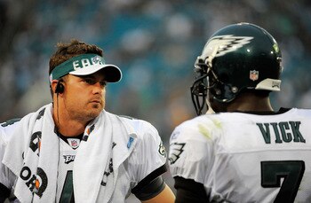 JACKSONVILLE, FL - SEPTEMBER 26:  Quarterbacks Kevin Kolb #4 and Michael Vick #7 of the Philadelphia Eagles talk on the sidelines during a time-out against the Jacksonville Jaguars at EverBank Field on September 26, 2010 in Jacksonville, Florida. The Eagl