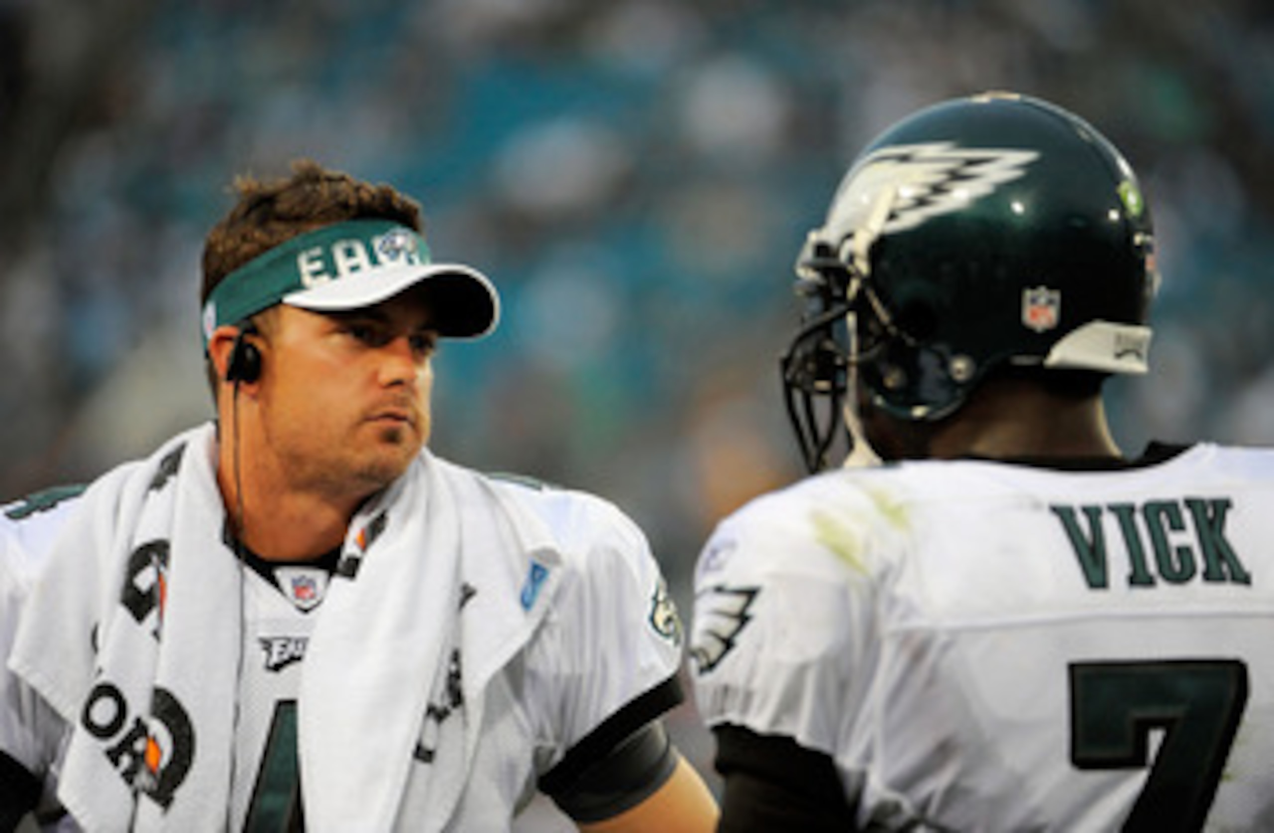 JACKSONVILLE, FL - SEPTEMBER 26:  Quarterbacks Kevin Kolb #4 and Michael Vick #7 of the Philadelphia Eagles talk on the sidelines during a time-out against the Jacksonville Jaguars at EverBank Field on September 26, 2010 in Jacksonville, Florida. The Eagl