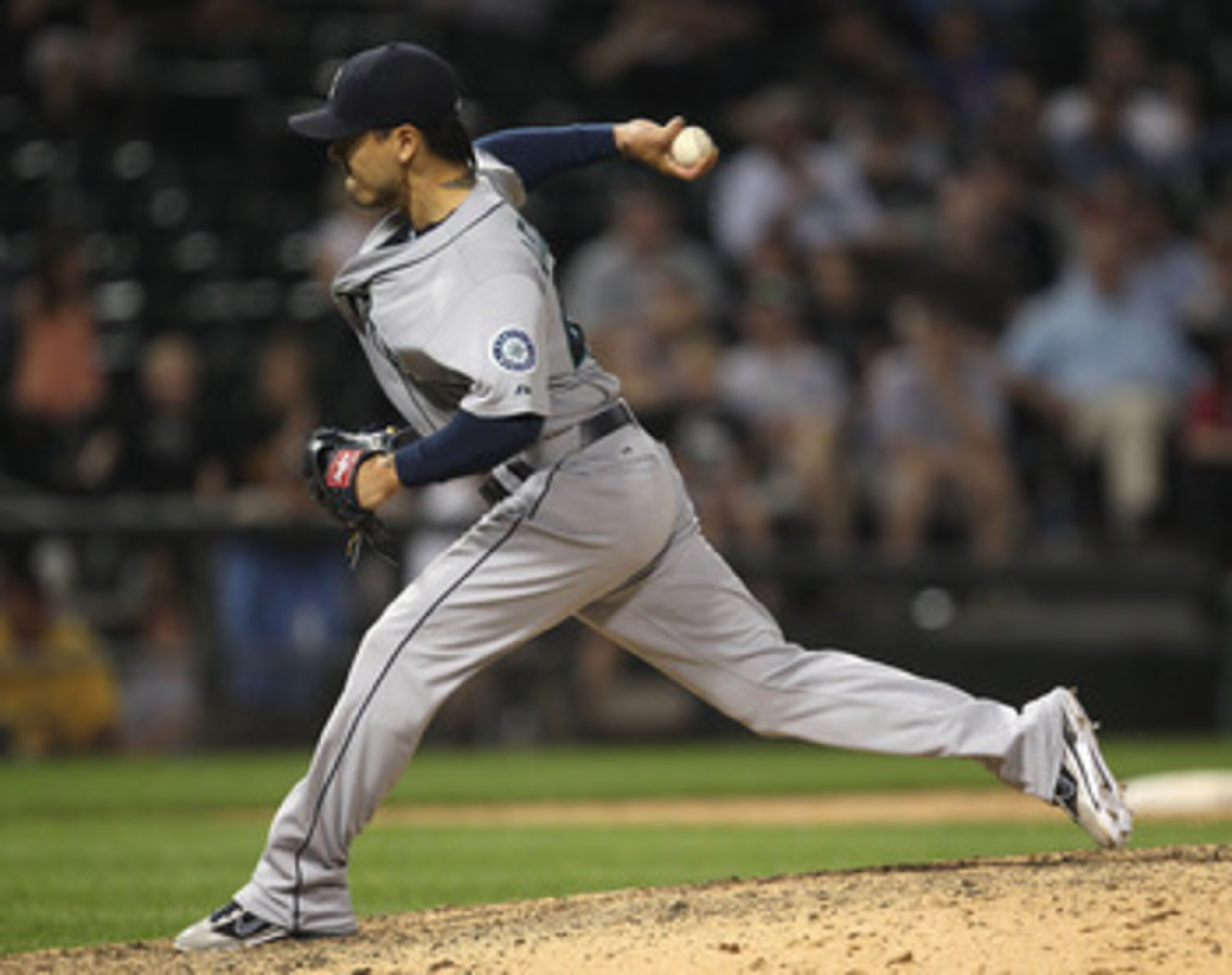 CHICAGO, IL - JUNE 08: Brandon League #43 of the Seattle Mariners pitches in the 10th inning against the Chicago White Sox at U.S. Cellular Field on June 8, 2011 in Chicago, Illinois. The Mariners defeated the White Sox 7-4 in 10 innings. (Photo by Jonath