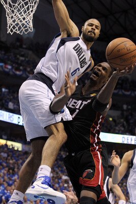 DALLAS, TX - JUNE 09:  Chris Bosh #1 of the Miami Heat drives for a shot attempt against Tyson Chandler #6 of the Dallas Mavericks in the fourth quarter of Game Five of the 2011 NBA Finals at American Airlines Center on June 9, 2011 in Dallas, Texas.  NOT