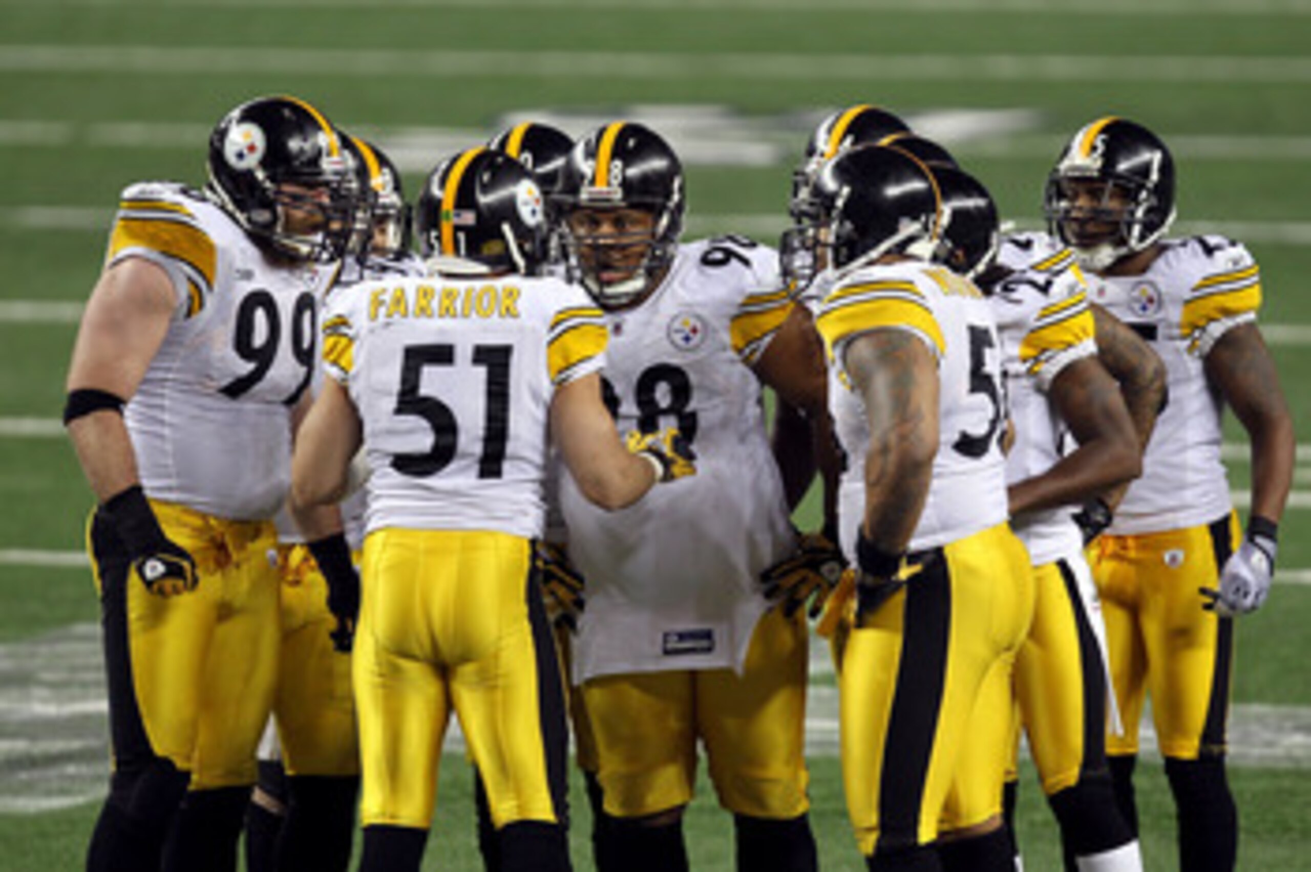 ARLINGTON, TX - FEBRUARY 06:  James Farrior #51 of the Pittsburgh Steelers calls a play in the defensive huddle as Brett Keisel #99 and Casey Hampton #98 (c) look on against the Green Bay Packers during Super Bowl XLV at Cowboys Stadium on February 6, 201