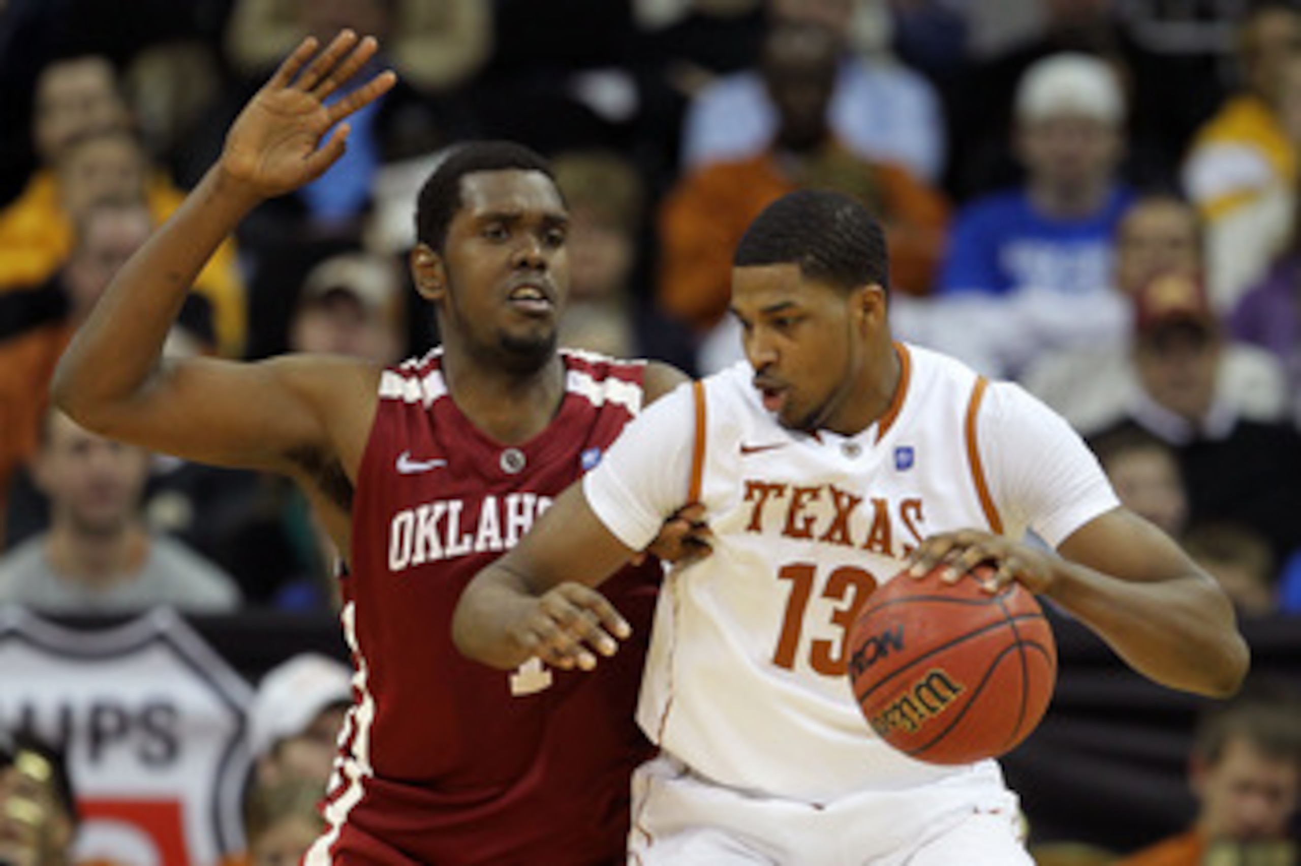 KANSAS CITY, MO - MARCH 10:  Tristan Thompson #13 of the Texas Longhorns drives with the ball against Andrew Fitzgerald #4 of the Oklahoma Sooners during their quarterfinal game in the 2011 Phillips 66 Big 12 Men's Basketball Tournament at Sprint Center o
