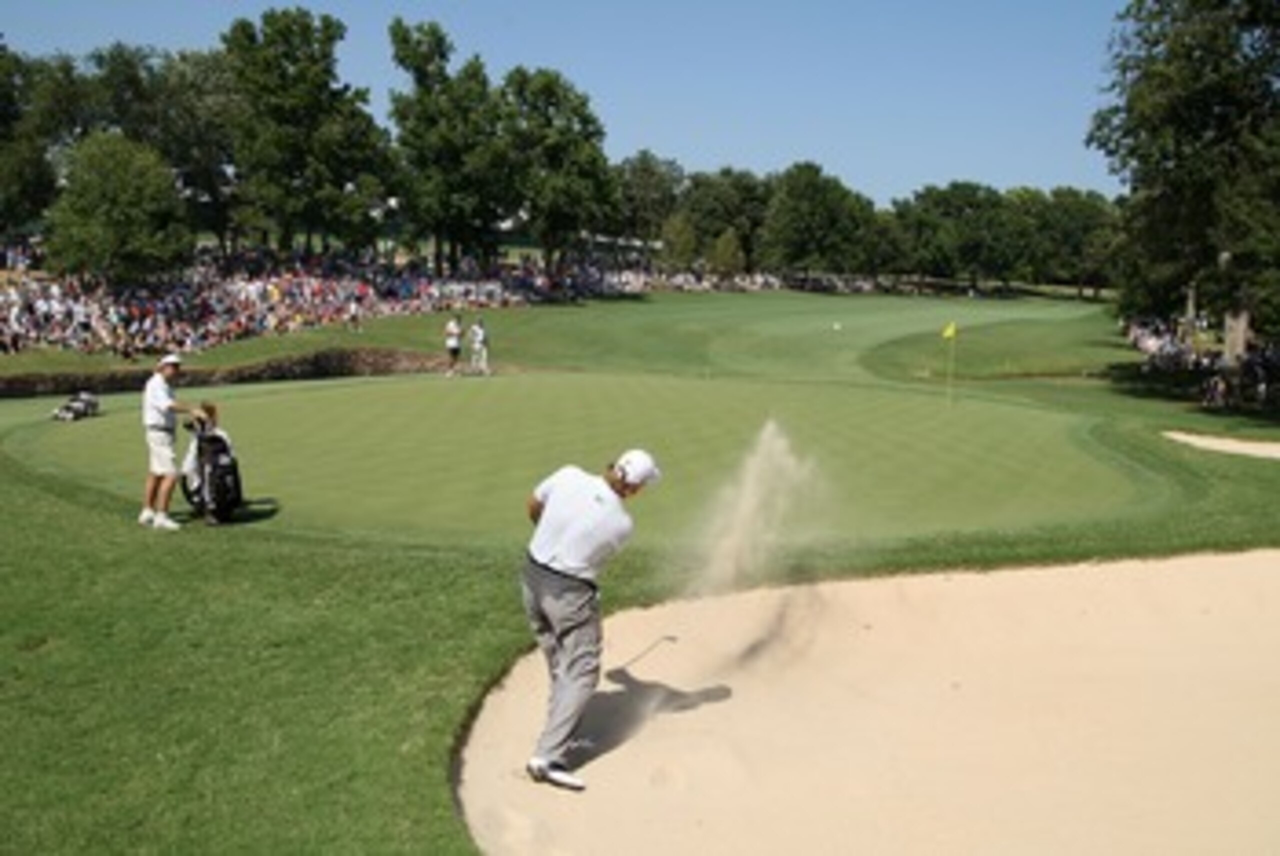 TULSA, OK - AUGUST 12:  Ernie Els of South Africa plays a bunker shot on the 12th green during the final round of the 89th PGA Championship at the Southern Hills Country Club on August 12, 2007 in Tulsa, Oklahoma.  (Photo by David Cannon/Getty Images)