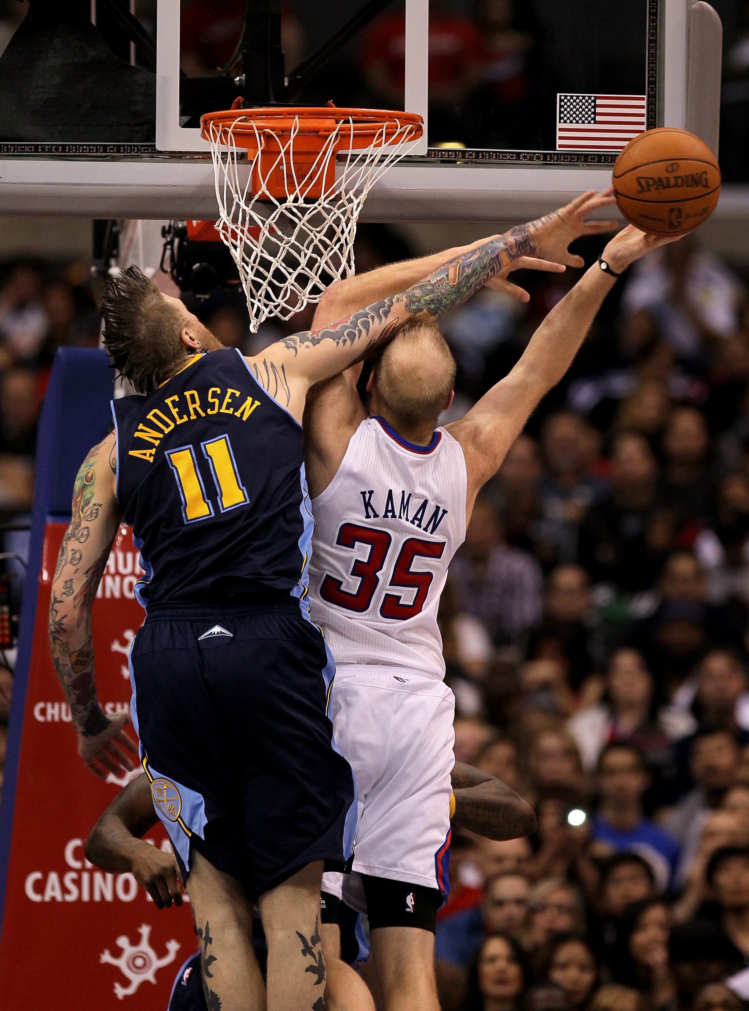LOS ANGELES, CA - MARCH 5:   Chris Andersen #11 of the Denver Nuggets blocks a shot attempt by Chris Kaman #35 of the Los Angeles Clippers at Staples Center on March 5, 2011 in Los Angeles, California. The Clippers won 100-94. NOTE TO USER: User expressly