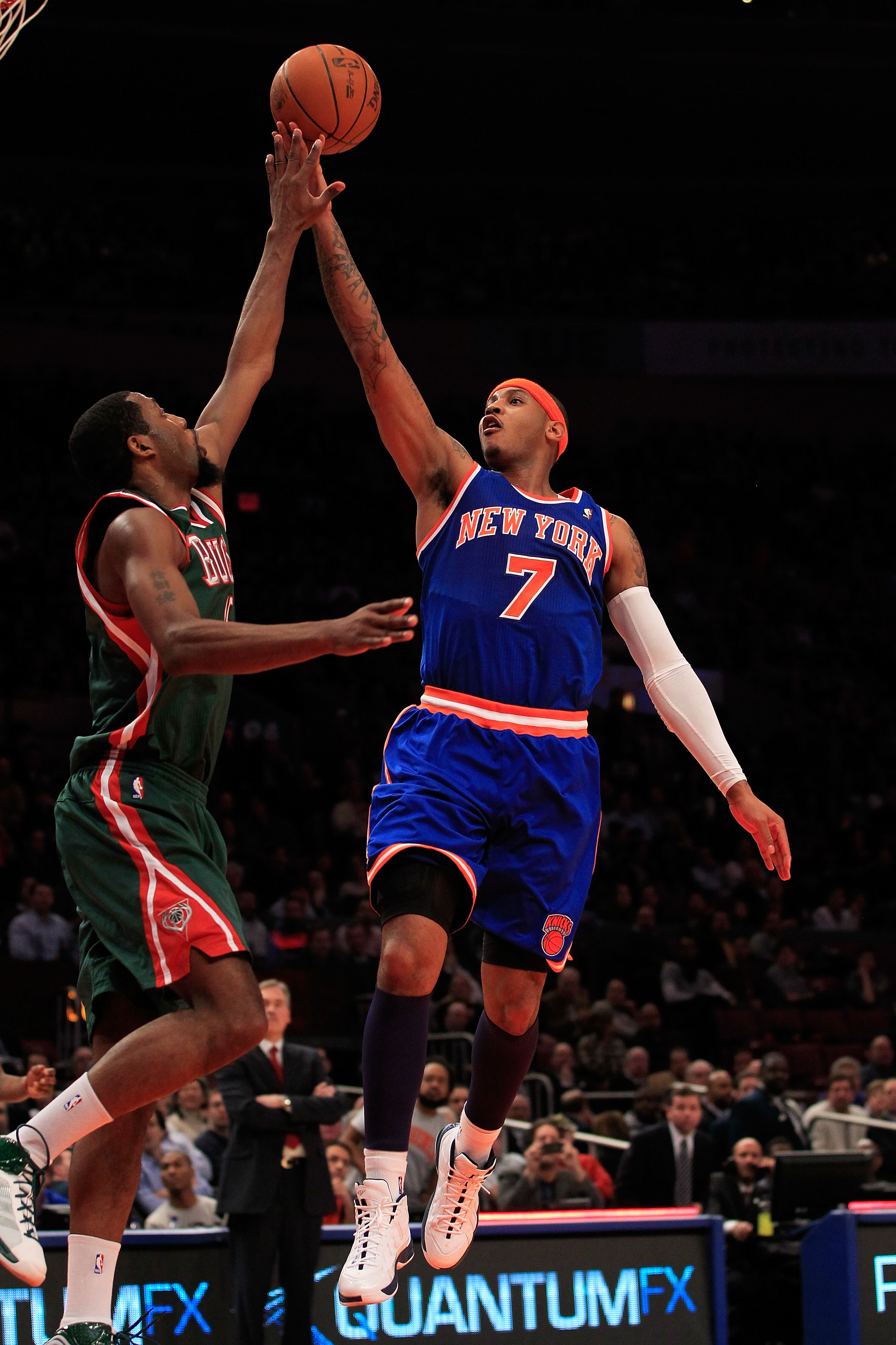 NEW YORK, NY - FEBRUARY 23:  Carmelo Anthony #7 of the New York Knicks goes up for a basket against John Salmons #15 of the Milwaukee Bucks at Madison Square Garden on February 23, 2011 in New York City. NOTE TO USER: User expressly acknowledges and agree