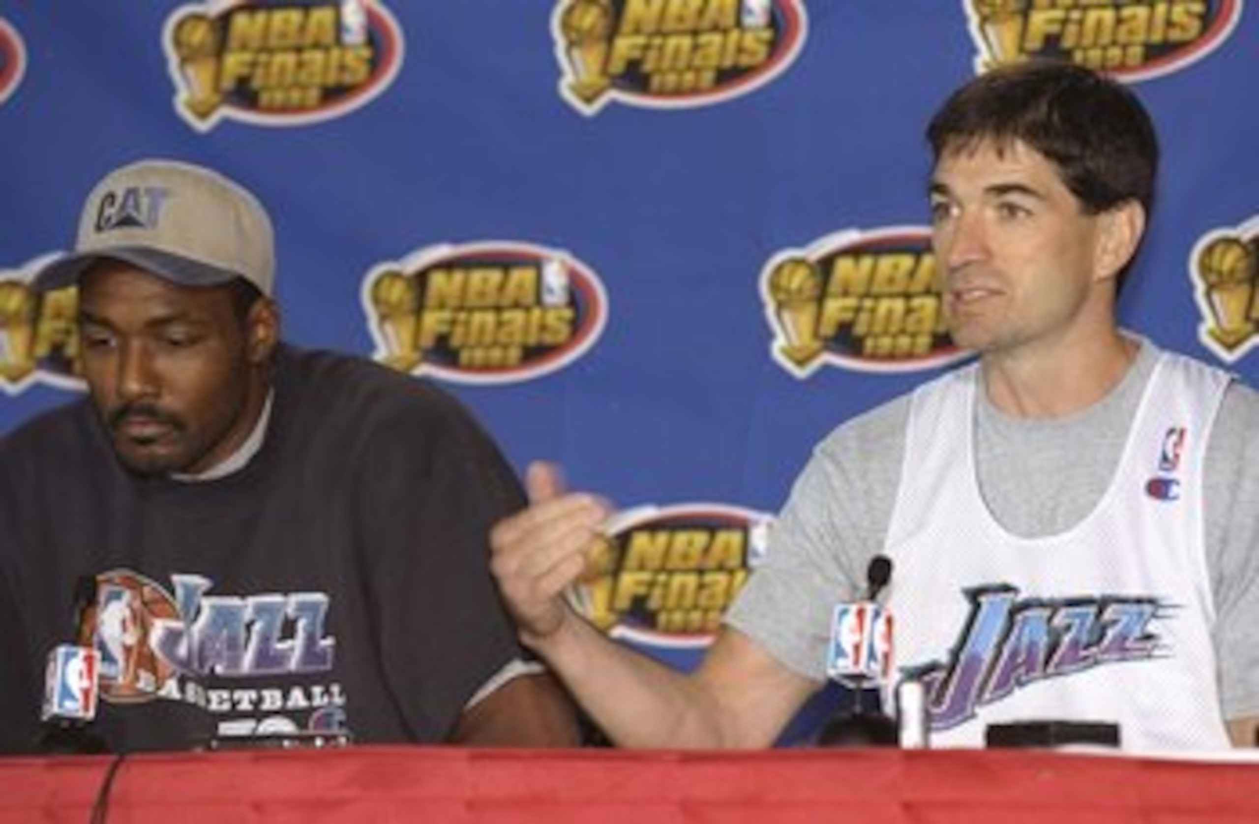 8 Jun 1998:  John Stockton and Karl Malone of the Utah Jazz talks about their game  against the Chicago Bulls during a press conference at the United Center in Chicago, Illinois. Mandatory Credit: Jonathan Daniel  /Allsport