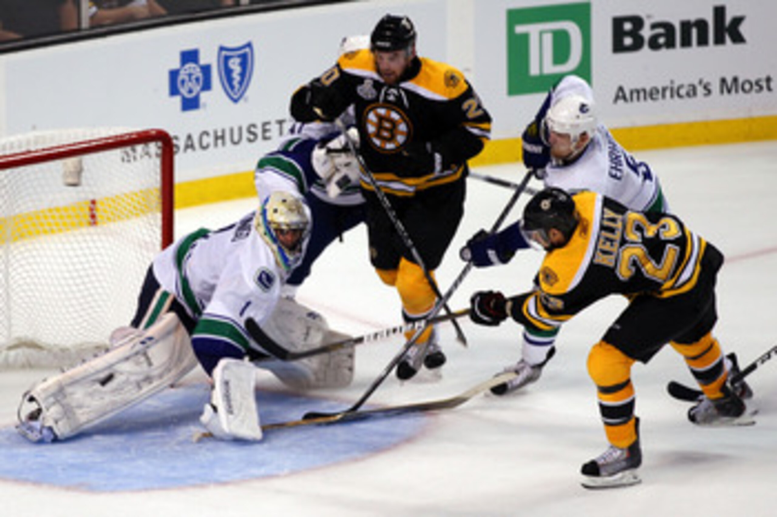 BOSTON, MA - JUNE 06:  Chris Kelly #23 of the Boston Bruins scores a goal in the third period against Roberto Luongo #1 of the Vancouver Canucks during Game Three of the 2011 NHL Stanley Cup Final at TD Garden on June 6, 2011 in Boston, Massachusetts.  (P