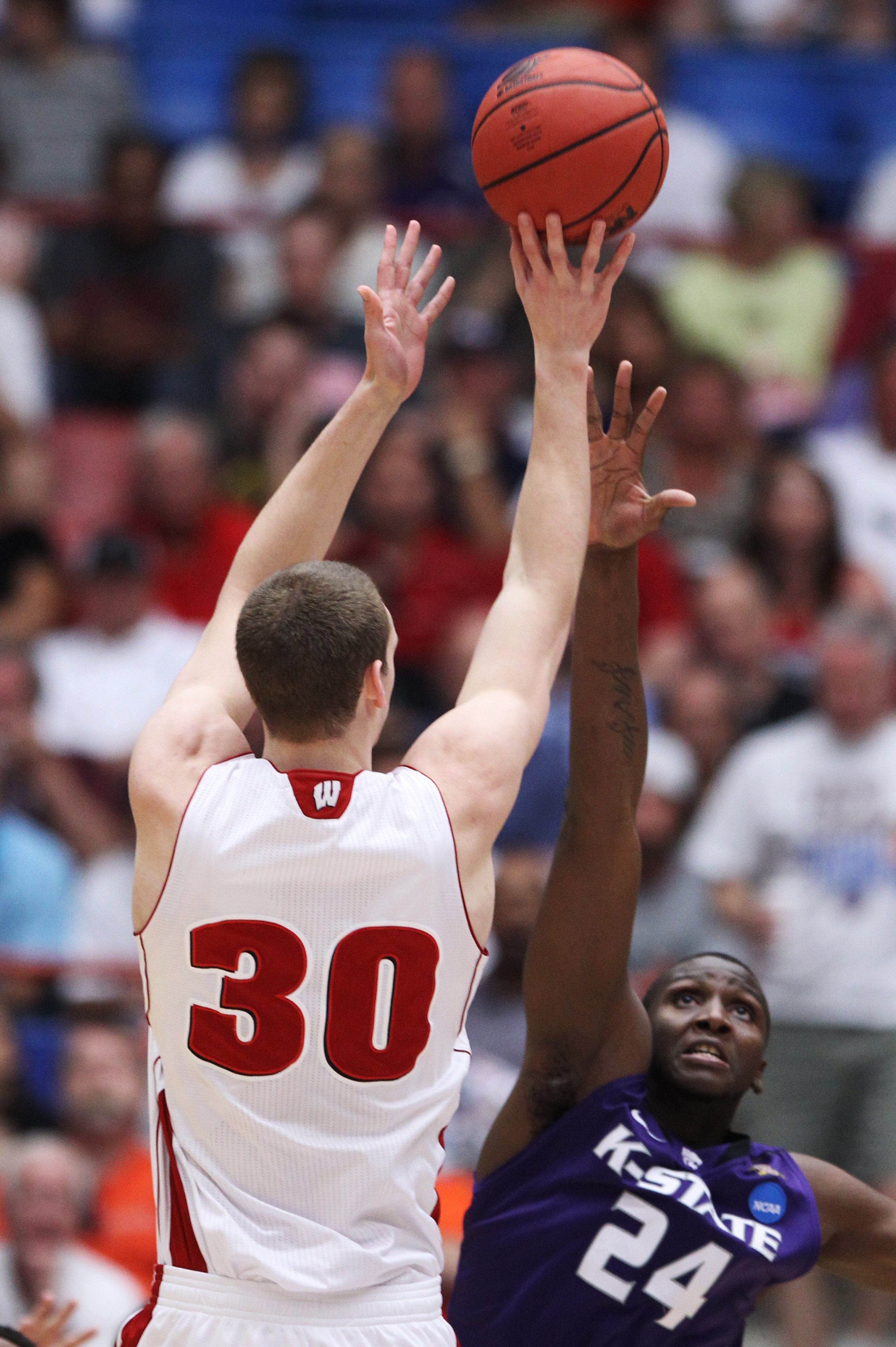TUCSON, AZ - MARCH 19:  Jon Leuer #30 of the Wisconsin Badgers shoots over Curtis Kelly #24 of the Kansas State Wildcats in the first half during the third round of the 2011 NCAA men's basketball tournament at McKale Center on March 19, 2011 in Tucson, Ar
