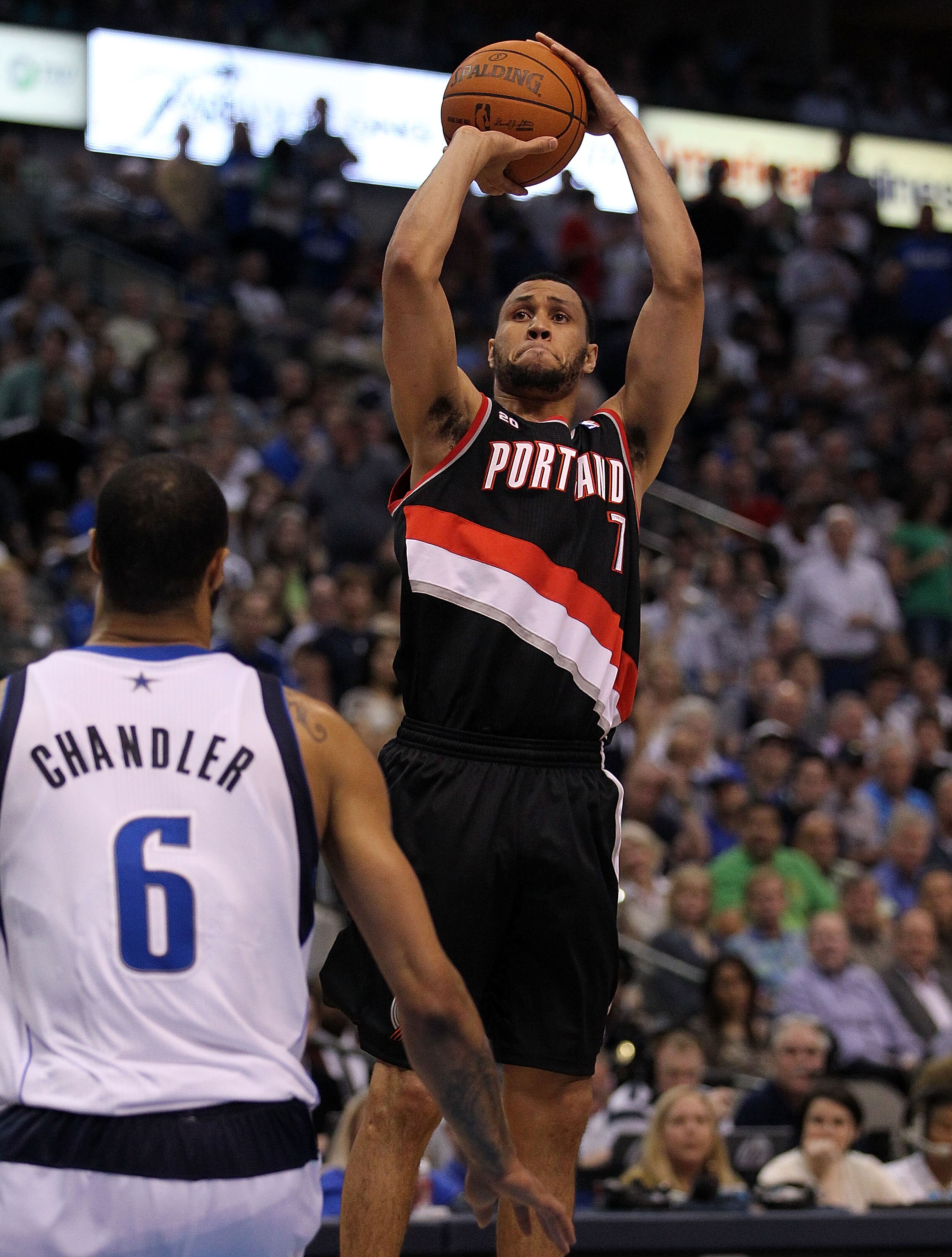 DALLAS, TX - APRIL 25:  Guard Brandon Roy #7 of the Portland Trail Blazers takes a shot against Tyson Chandler #6 of the Dallas Mavericks in Game Five of the Western Conference Quarterfinals during the 2011 NBA Playoffs on April 25, 2011 at American Airli