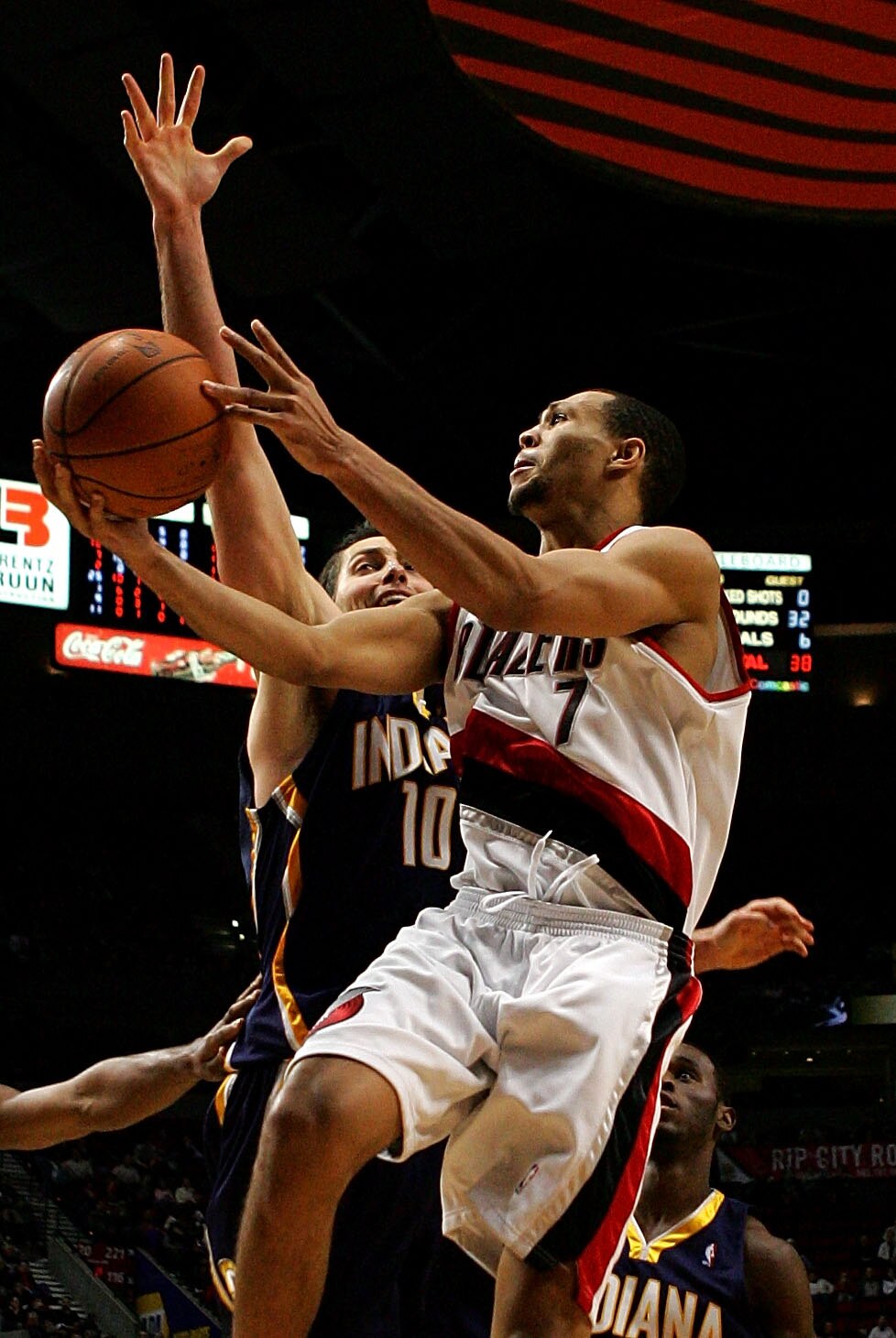 PORTLAND, OR - NOVEMBER 28:  Brandon Roy #7 of the Portland Trail Blazersdrives to the hoop against Jeff Foster #10 of the Indiana Pacers at the Rose Garden on November 28, 2007 in Portland, Oregon.  NOTE TO USER: User expressly acknowledges and agrees th