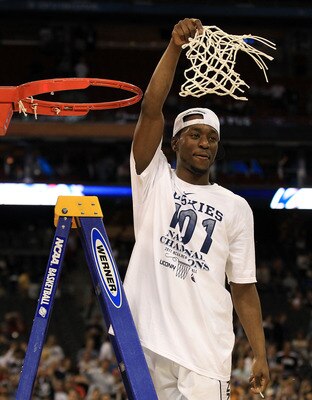 HOUSTON, TX - APRIL 04:  Kemba Walker #15 of the Connecticut Huskies cuts down the net after defeating the Butler Bulldogs to win the National Championship Game of the 2011 NCAA Division I Men's Basketball Tournament by a score of 53-41 at Reliant Stadium