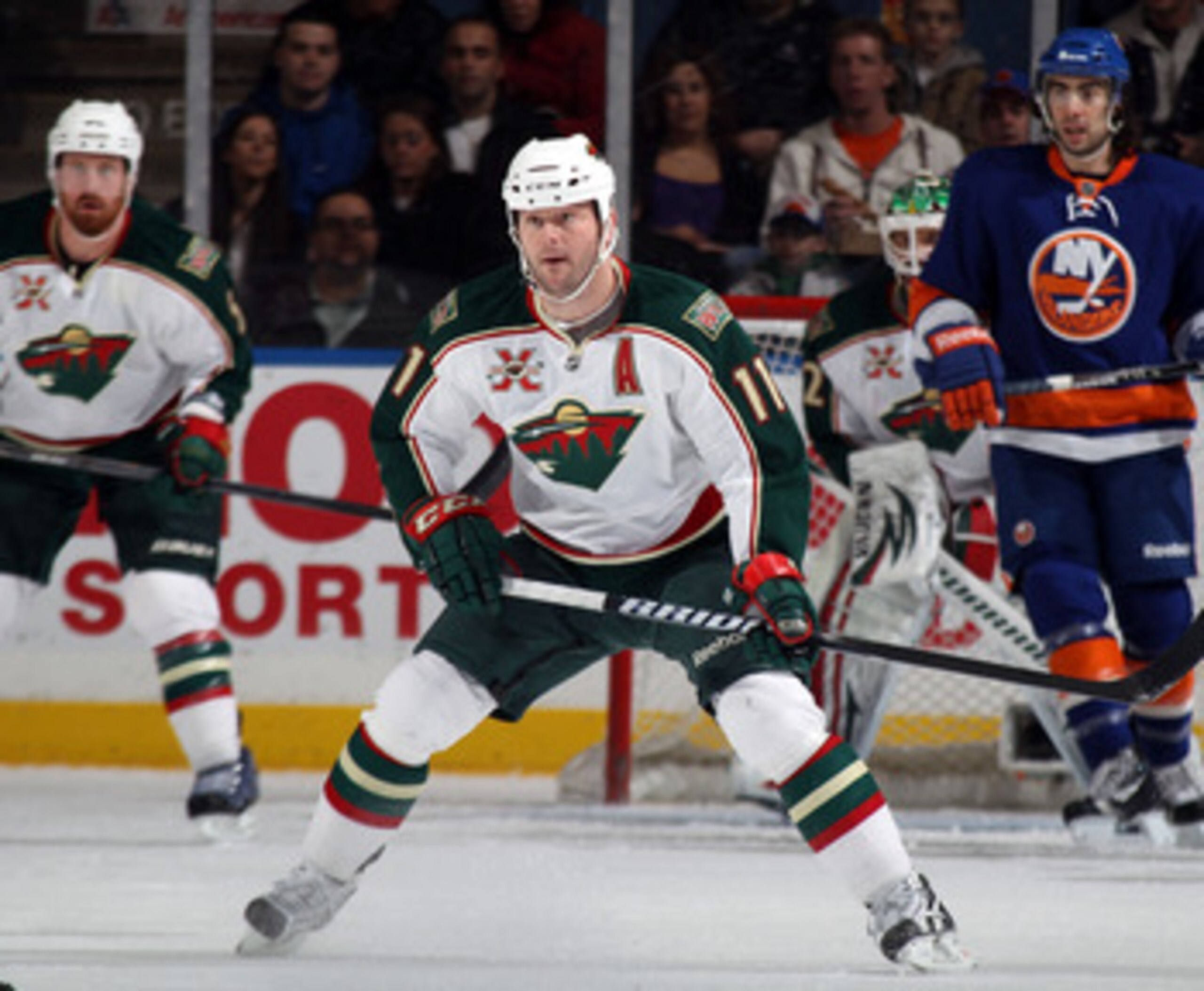 UNIONDALE, NY - MARCH 02:  John Madden #11 of the Minnesota Wild skates against the New York Islanders at the Nassau Coliseum on March 2, 2011 in Uniondale, New York. The Islanders defeated the Wild 4-1.  (Photo by Bruce Bennett/Getty Images)