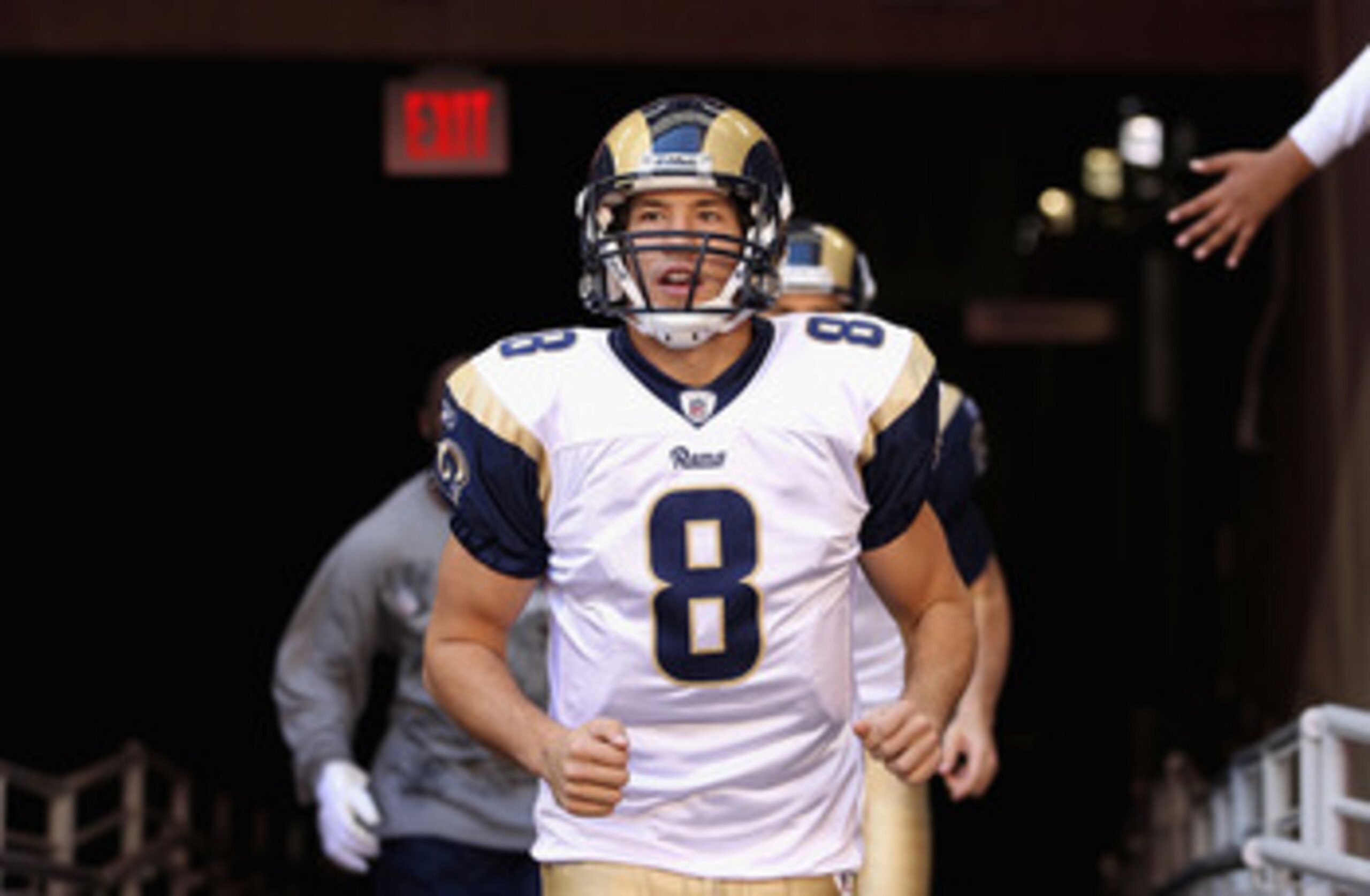 DENVER - NOVEMBER 28:  Quarterback Sam Bradford #8 of the St. Louis Rams makes a pass during the third quarter against the Denver Broncos at INVESCO Field at Mile High on November 28, 2010 in Denver, Colorado. The Rams defeated the Broncos 36-33. (Photo b