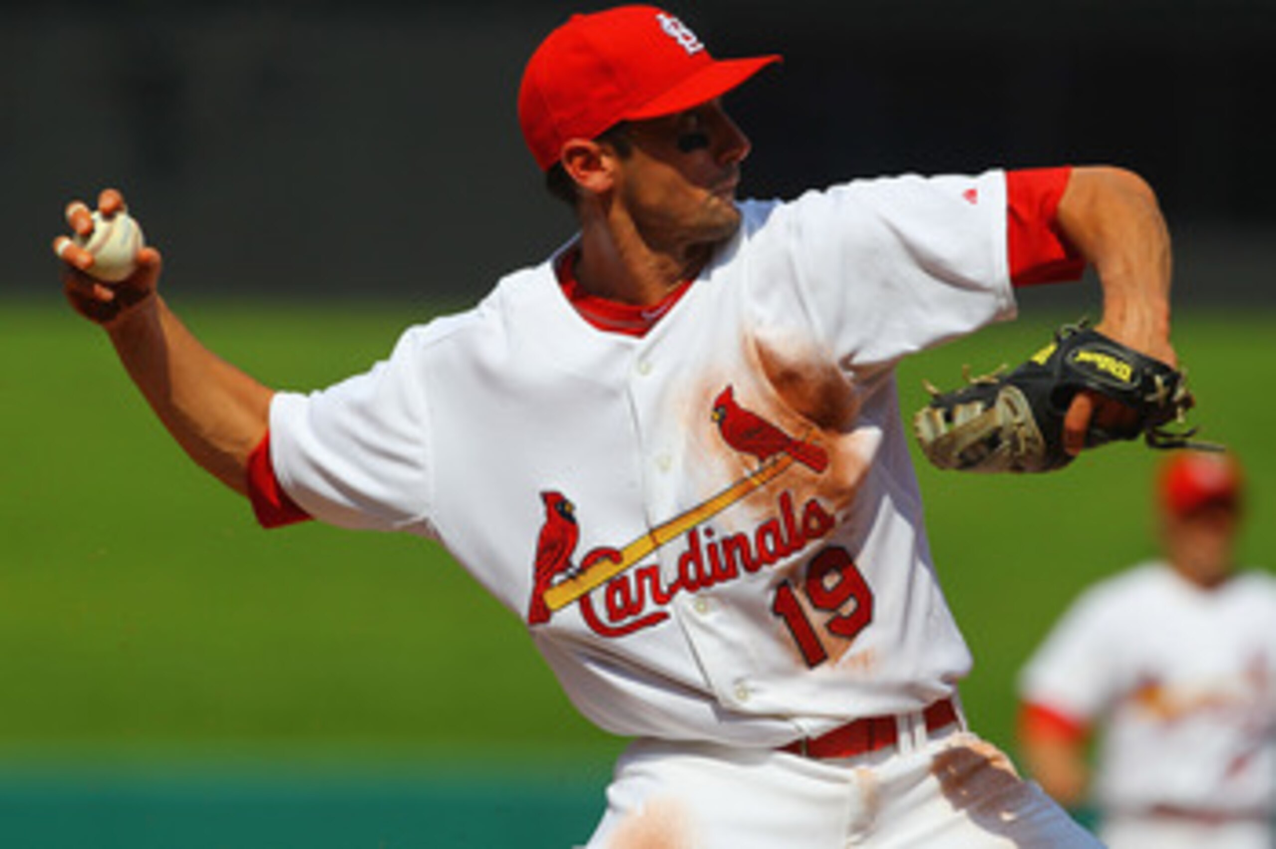 ST. LOUIS, MO - JUNE 4: Matt Carpenter #19 of the St. Louis Cardinals throws to first base against the Chicago Cubs in his major league debut at Busch Stadium on June 4, 2011 in St. Louis, Missouri.  The Cardinals beat the Cubs 5-4 in 12 innings.  (Photo 