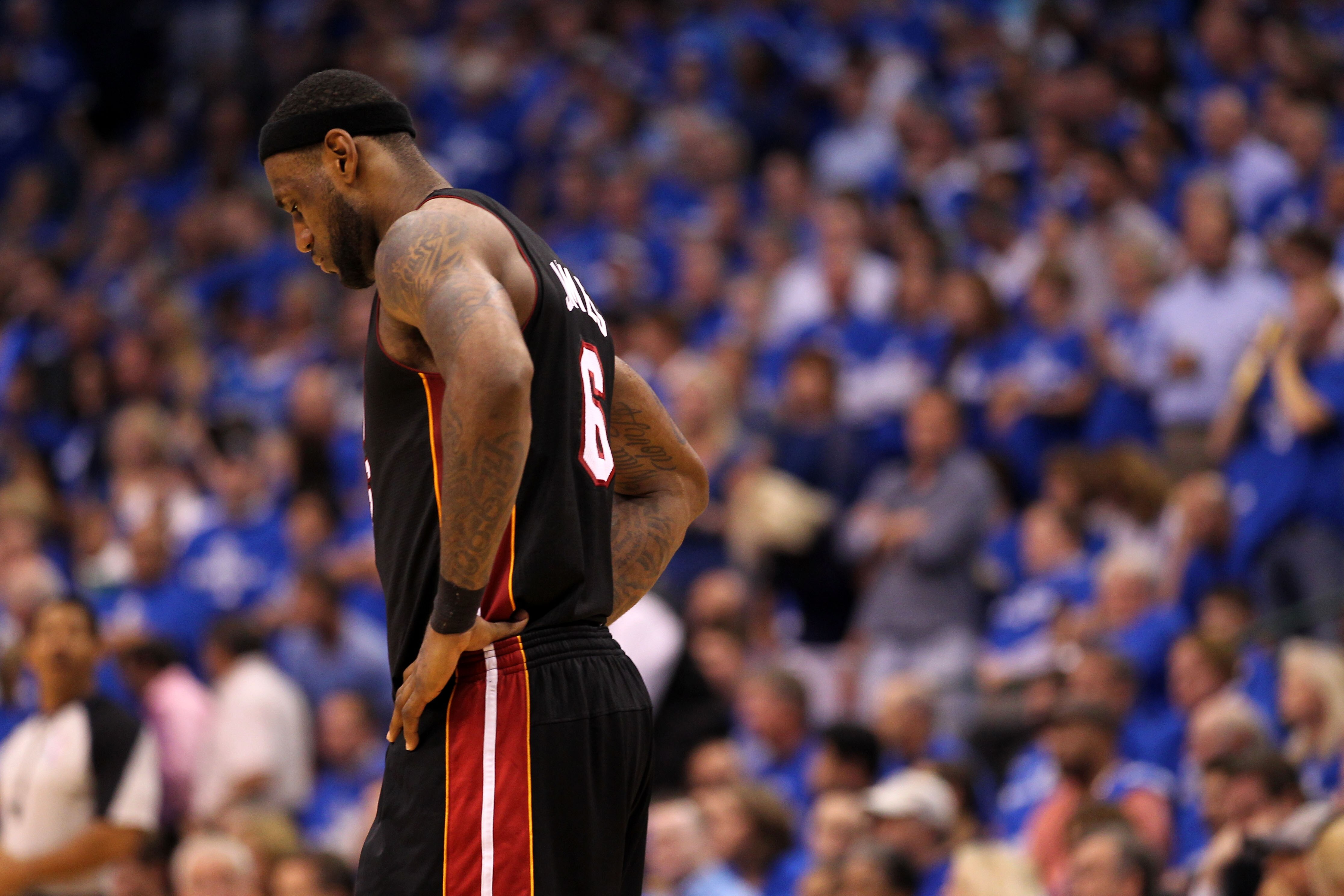 DALLAS, TX - JUNE 09:  LeBron James #6 of the Miami Heat stands on the court with his head down against the Dallas Mavericks in the fourth quarter of Game Five of the 2011 NBA Finals at American Airlines Center on June 9, 2011 in Dallas, Texas.  NOTE TO U