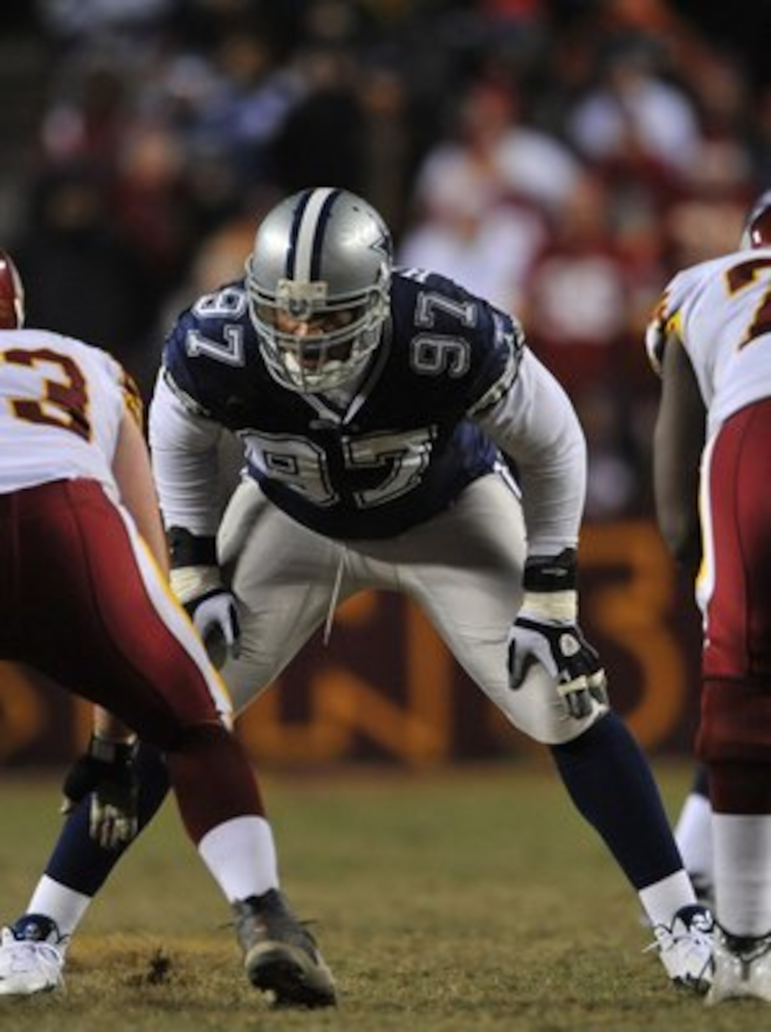 LANDOVER, MD - DECEMBER 27:  Jason Hatcher #97 of the Dallas Cowboys defends against the Washington Redskins at FedExField on December 27, 2009 in Landover, Maryland. The Cowboys defeated the Redskins 17-0. (Photo by Larry French/Getty Images)