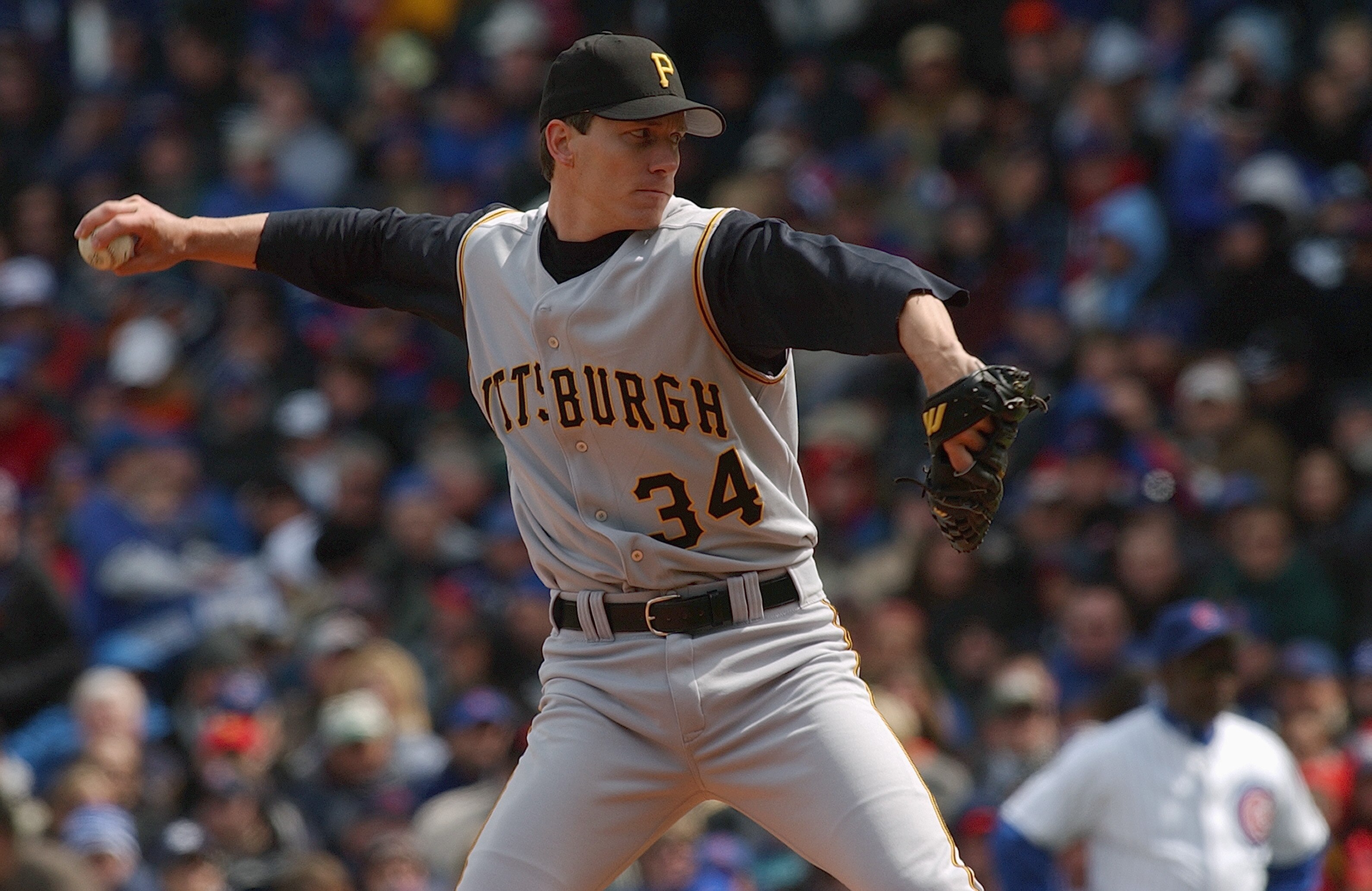 CHICAGO - APRIL 12:  Pitcher Kris Benson #34 of the Pittsburgh Pirates delivers a pitch to a Chicago Cubs batter during the Opening Day game on April 12, 2004 at Wrigley Field in Chicago, Illinois. The Pirates defeated the Cubs 13-2. (Photo by Jonathan Da
