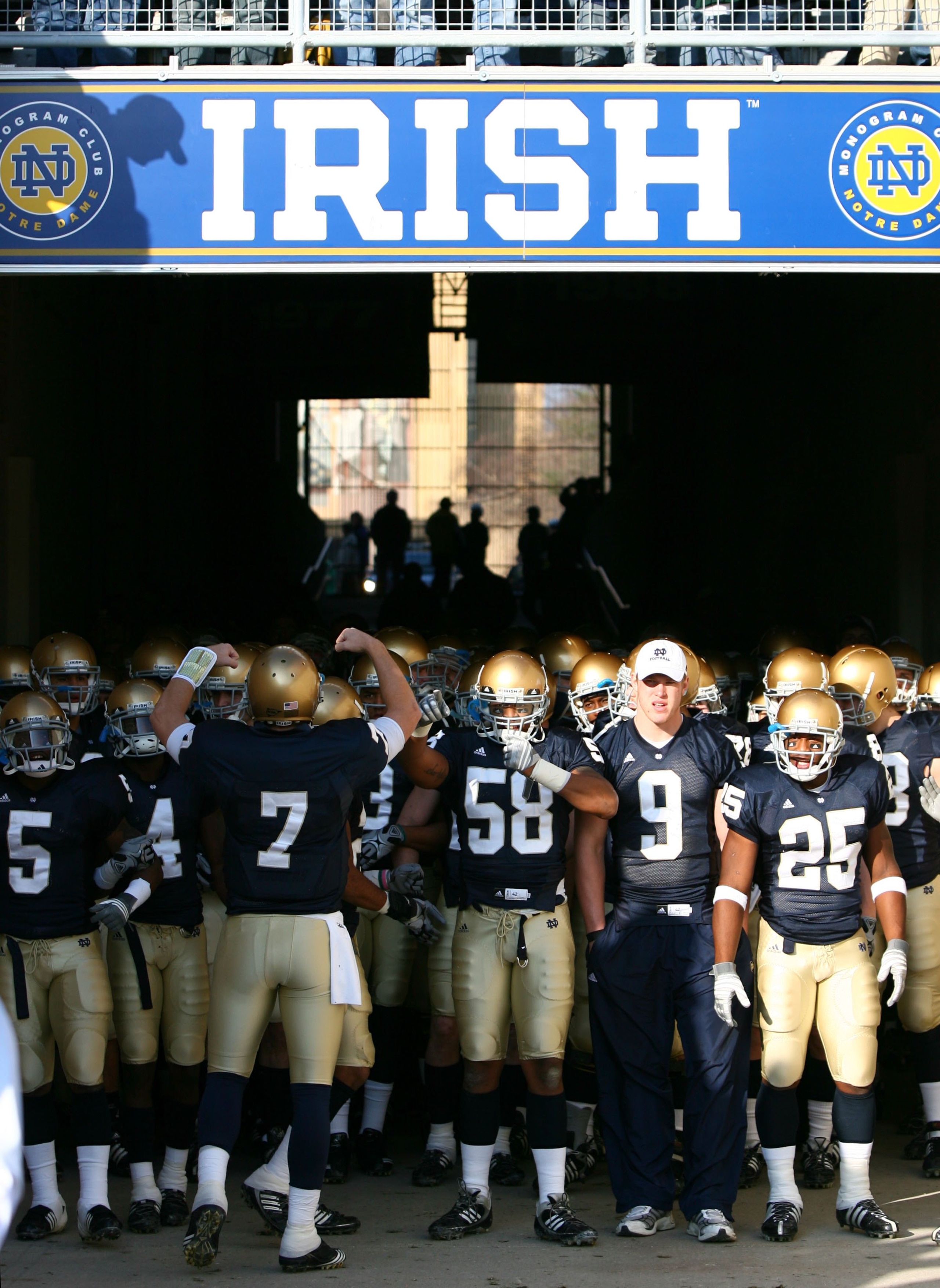 SOUTH BEND, IN - NOVEMBER 21: Members of the Notre Dame Fighting Irish wait to walk out of the tunnel before lining up to enter the field for a game against the Univeristy of Connecticut Huskies at Notre Dame Stadium on November 21, 2009 in South Bend, In SOUTH BEND, IN - NOVEMBER 21: Members of the Notre Dame Fighting Irish wait to walk out of the tunnel before lining up to enter the field for a game against the Univeristy of Connecticut Huskies at Notre Dame Stadium on November 21, 2009 in South Bend, In