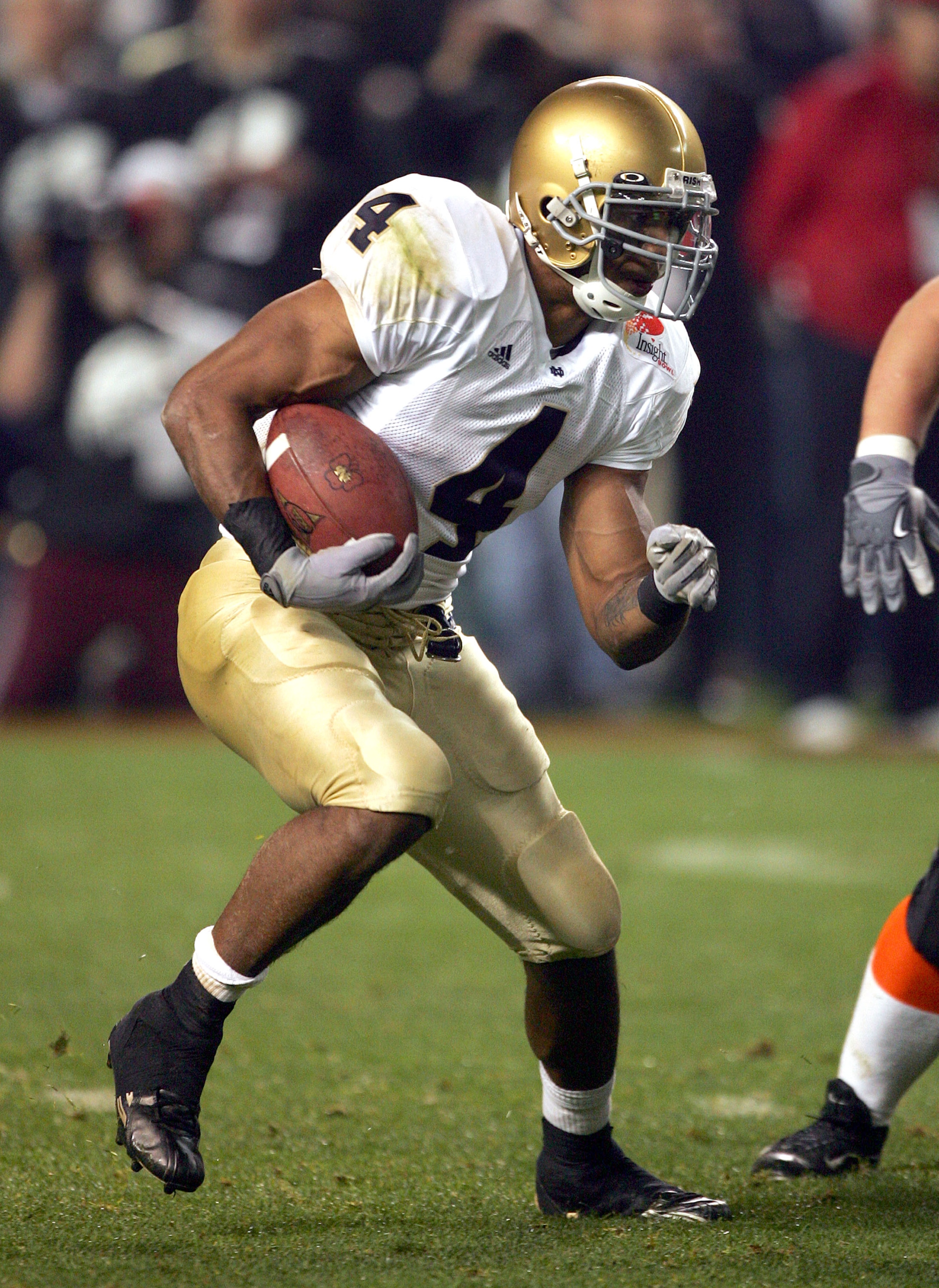 PHOENIX - DECEMBER 28: Running back Ryan Grant #4 of the Notre Dame Fighting Irish runs against the Oregon State Beavers in the Insight Bowl at Bank One Ballpark on December 28, 2004 in Phoenix, Arizona. Oregon State defeated Notre Dame 38-21. (Photo by PHOENIX - DECEMBER 28: Running back Ryan Grant #4 of the Notre Dame Fighting Irish runs against the Oregon State Beavers in the Insight Bowl at Bank One Ballpark on December 28, 2004 in Phoenix, Arizona. Oregon State defeated Notre Dame 38-21. (Photo by