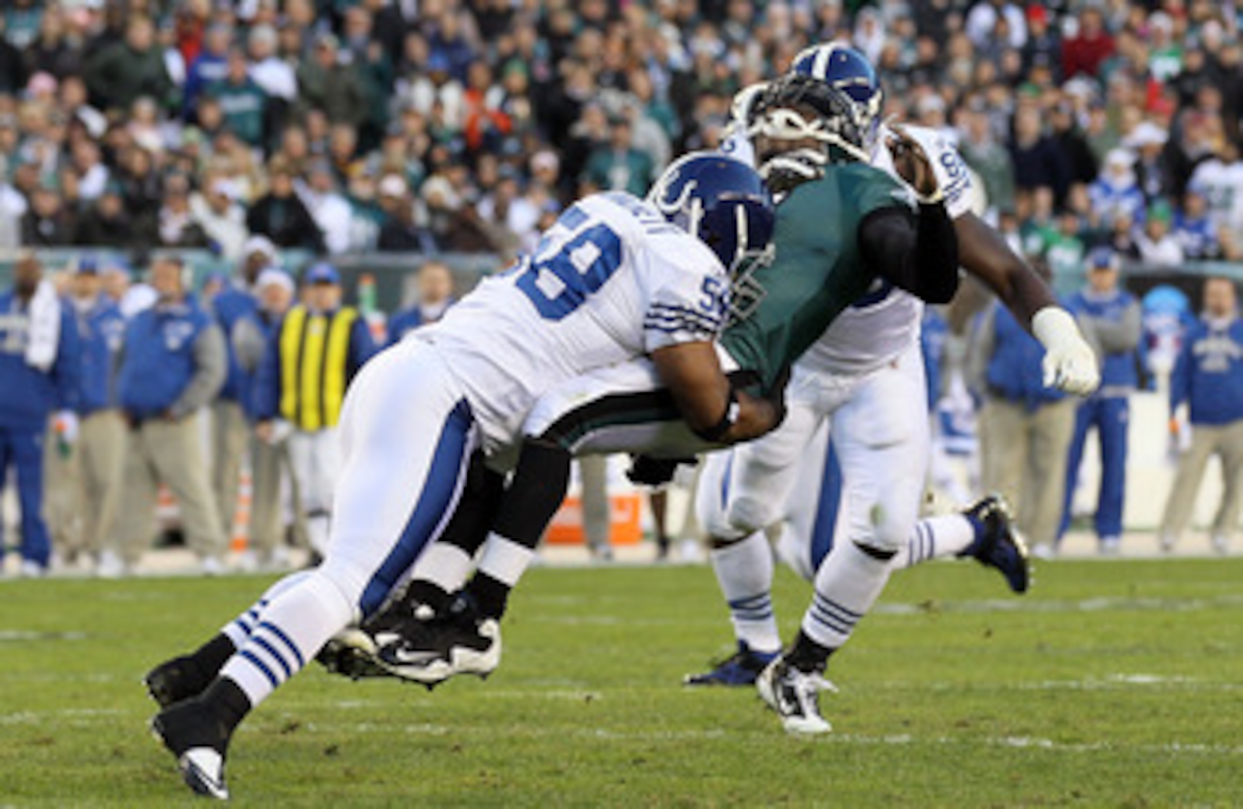 PHILADELPHIA - NOVEMBER 07:  Michael Vick #7 of the Philadelphia Eagles is hit hard by Gary Brackett #58 of the Indianapolis Colts after throwing a pass on November 7, 2010 at Lincoln Financial Field in Philadelphia, Pennsylvania.  (Photo by Jim McIsaac/G